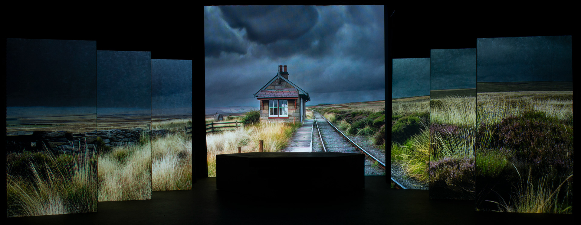 image of theatre projection - train station on the moors