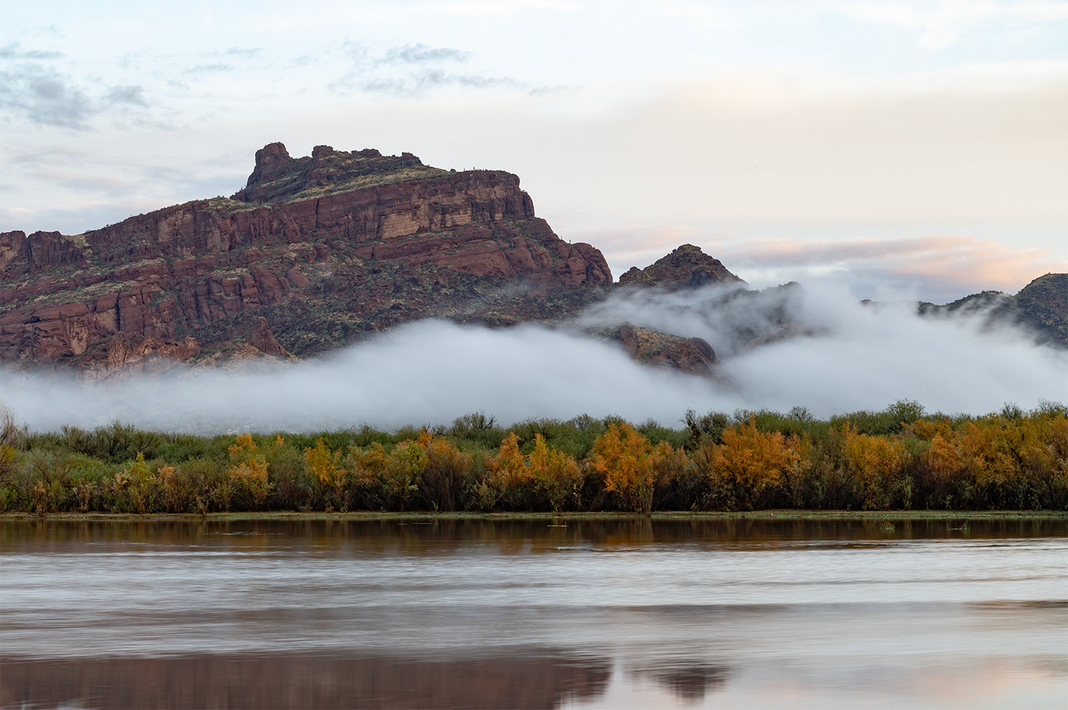 Fog drifting across the base of Red Mountain