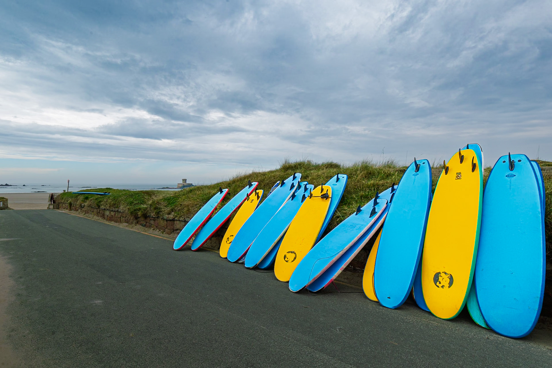 surf school surf boards waiting for the students at St Ouen's bay.