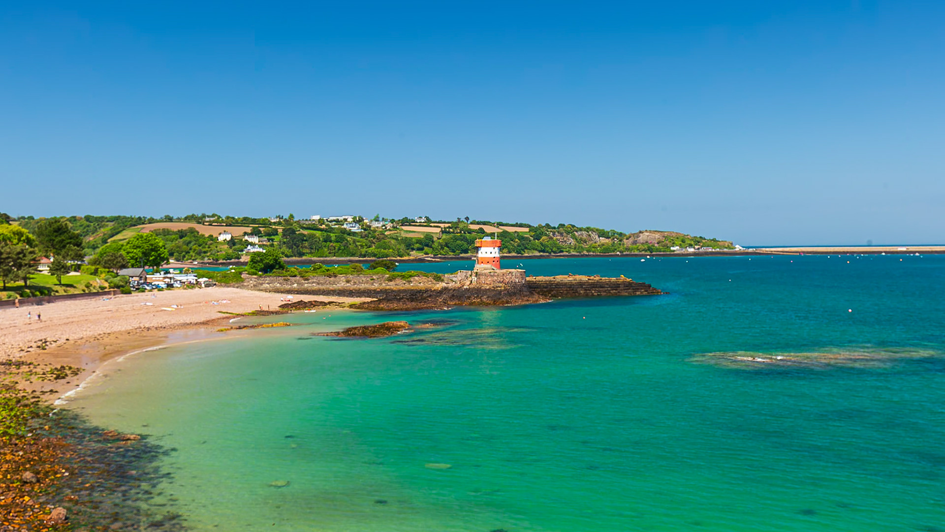 Archirondel Tower and beach and clear water.