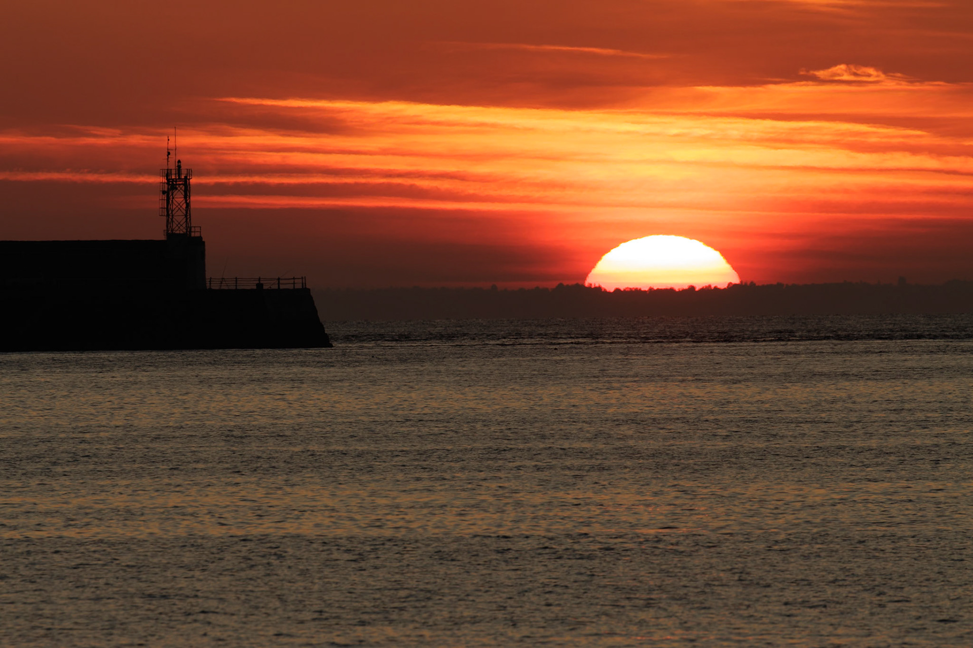 Sunrise over distant Normandy.