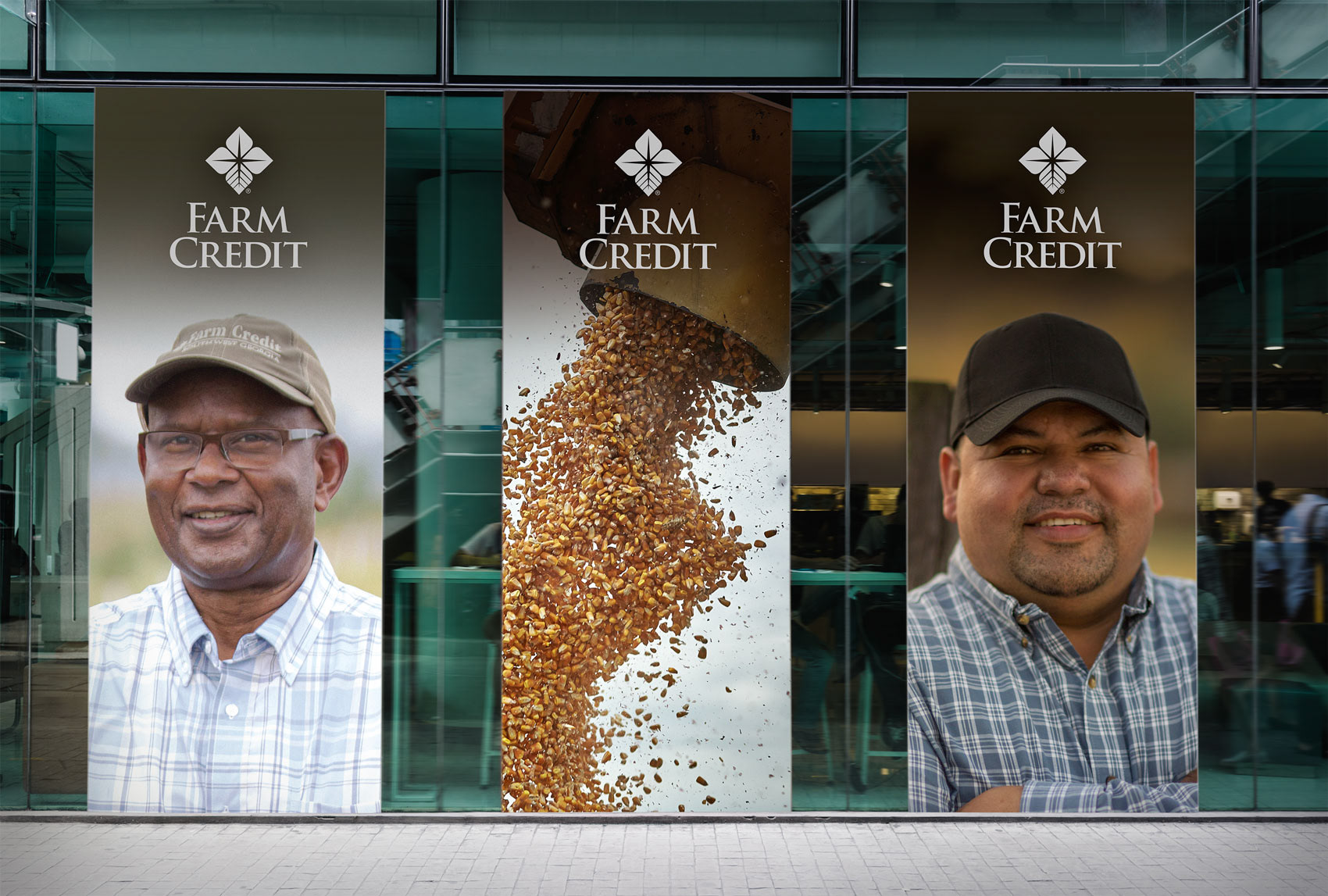 three pop-up display banner showcasing two Farm Credit customers and a truck dumping kernels