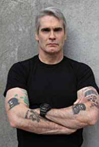 Henry Rollins Known for Feast (2005), Johnny Mnemonic (1995), Lost Highway (1997), He Never Died (2015)