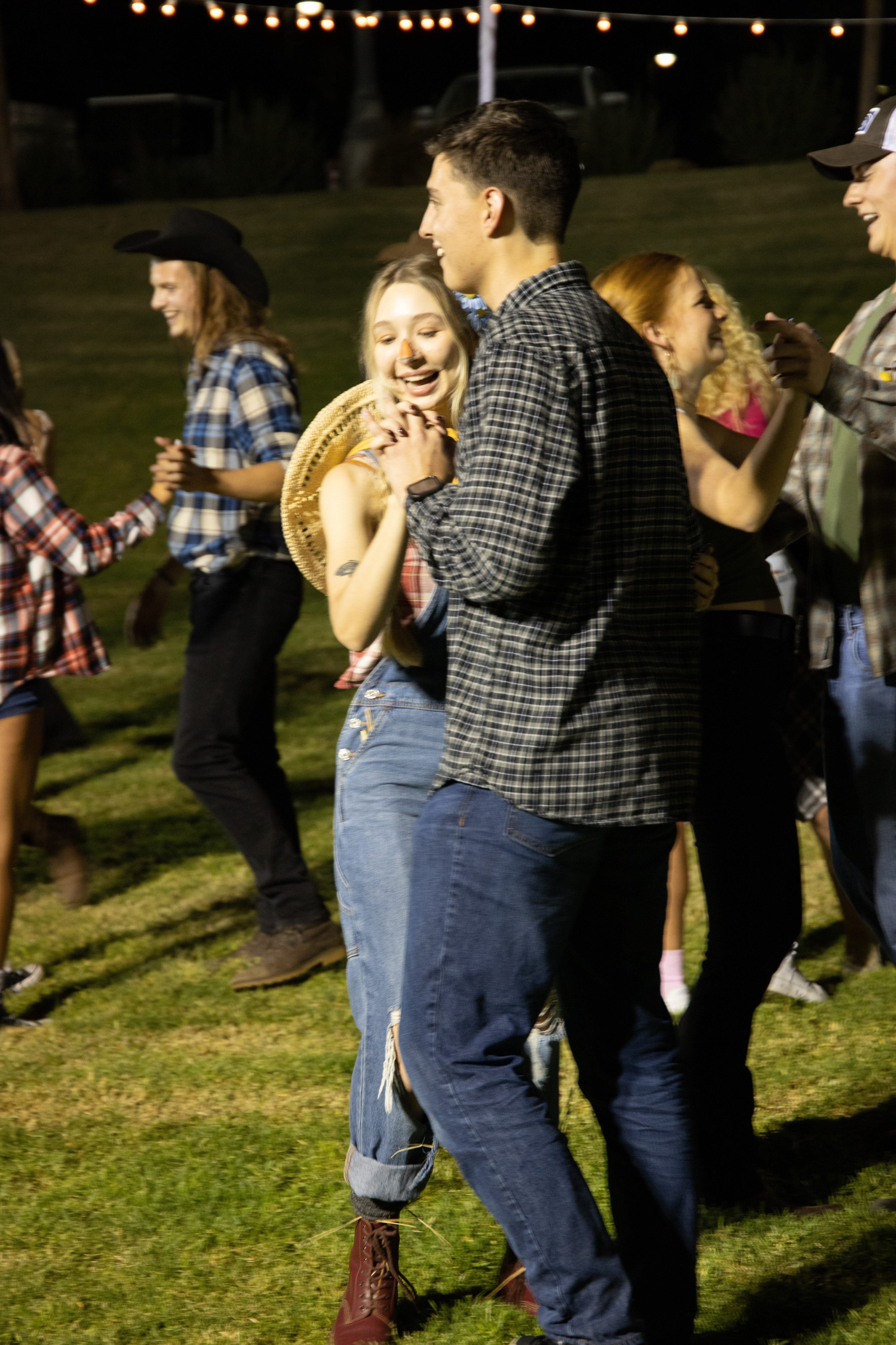 Brenna Buell, a junior graphic design major, and Jordan Hye, a senior liberal sciences major dancing a waltz.