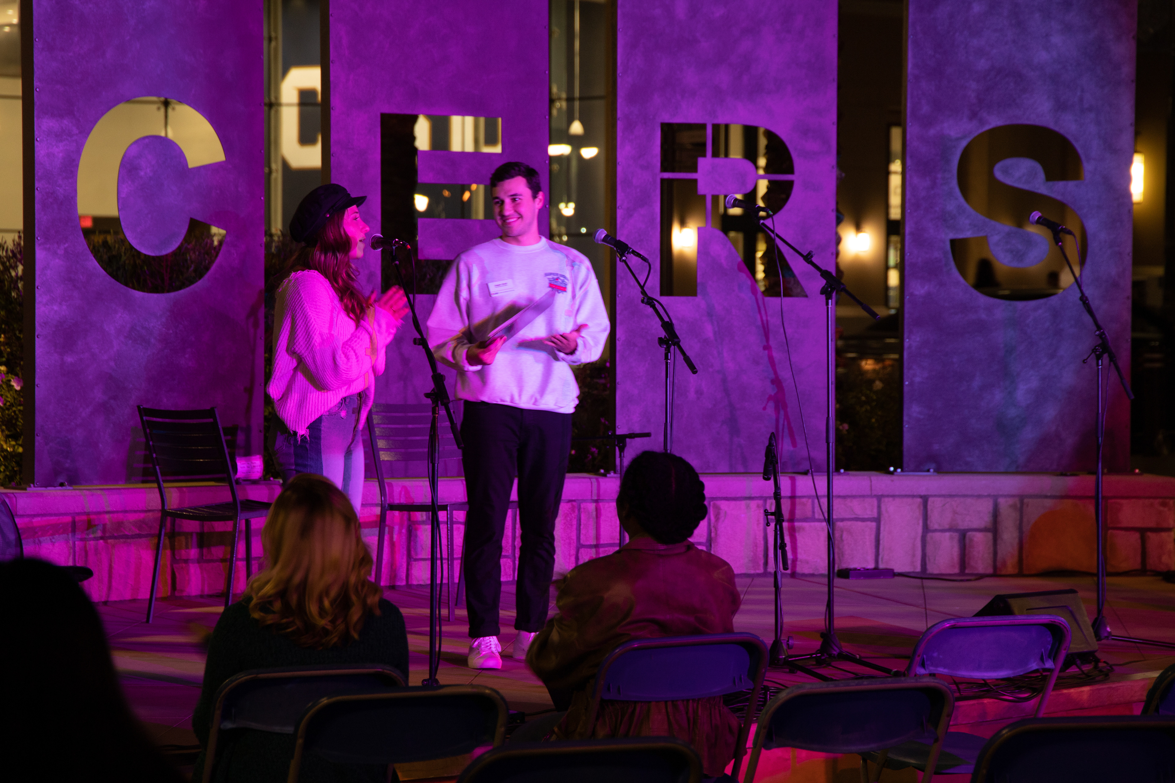 Catherine Spach, a senior Behavioral Science major, and Cooper Strull, a senior Business Administration major introducing the performers.