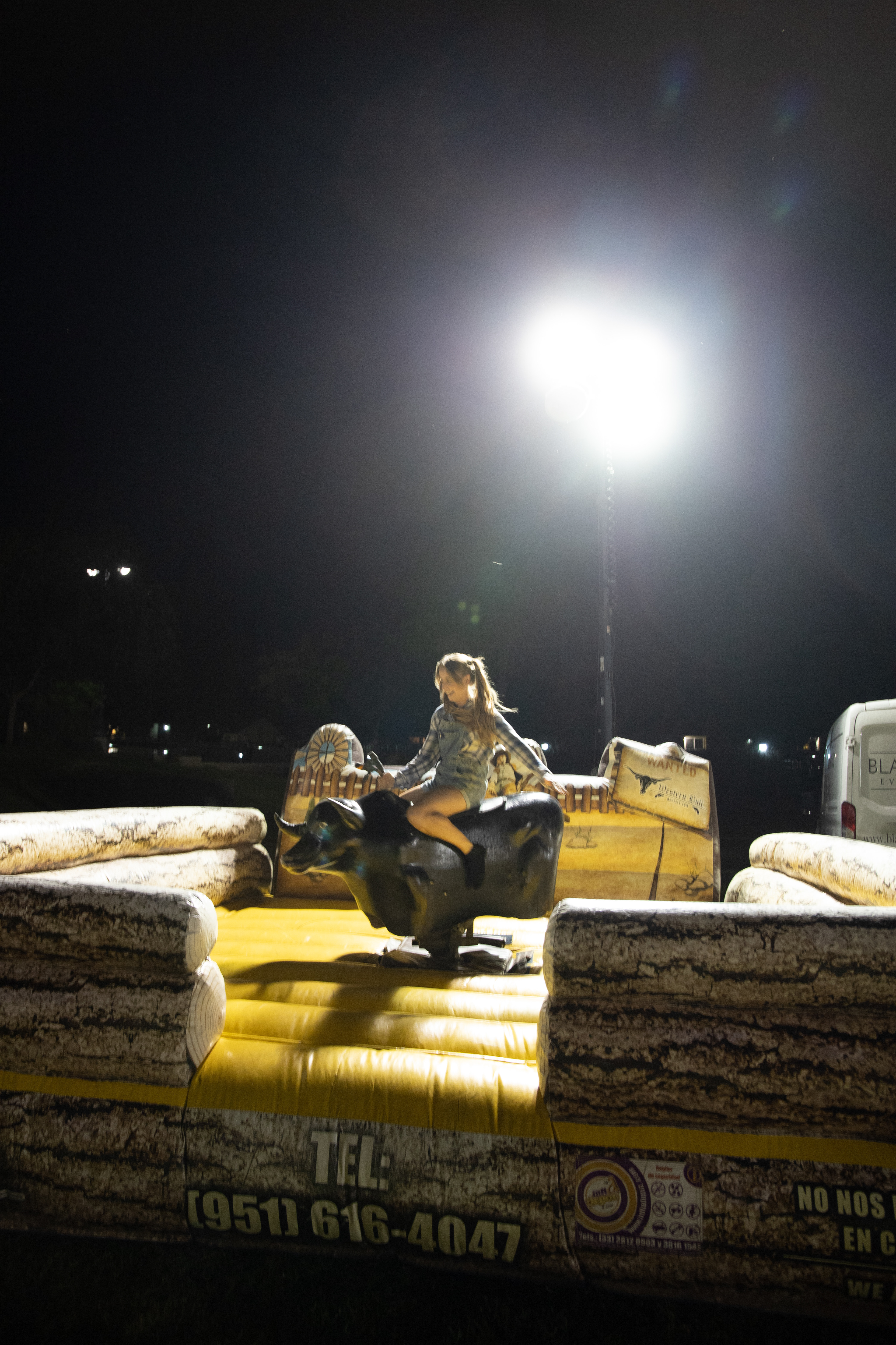 Haley Whittaker, a senior nursing major, takes on the mechanical bull.