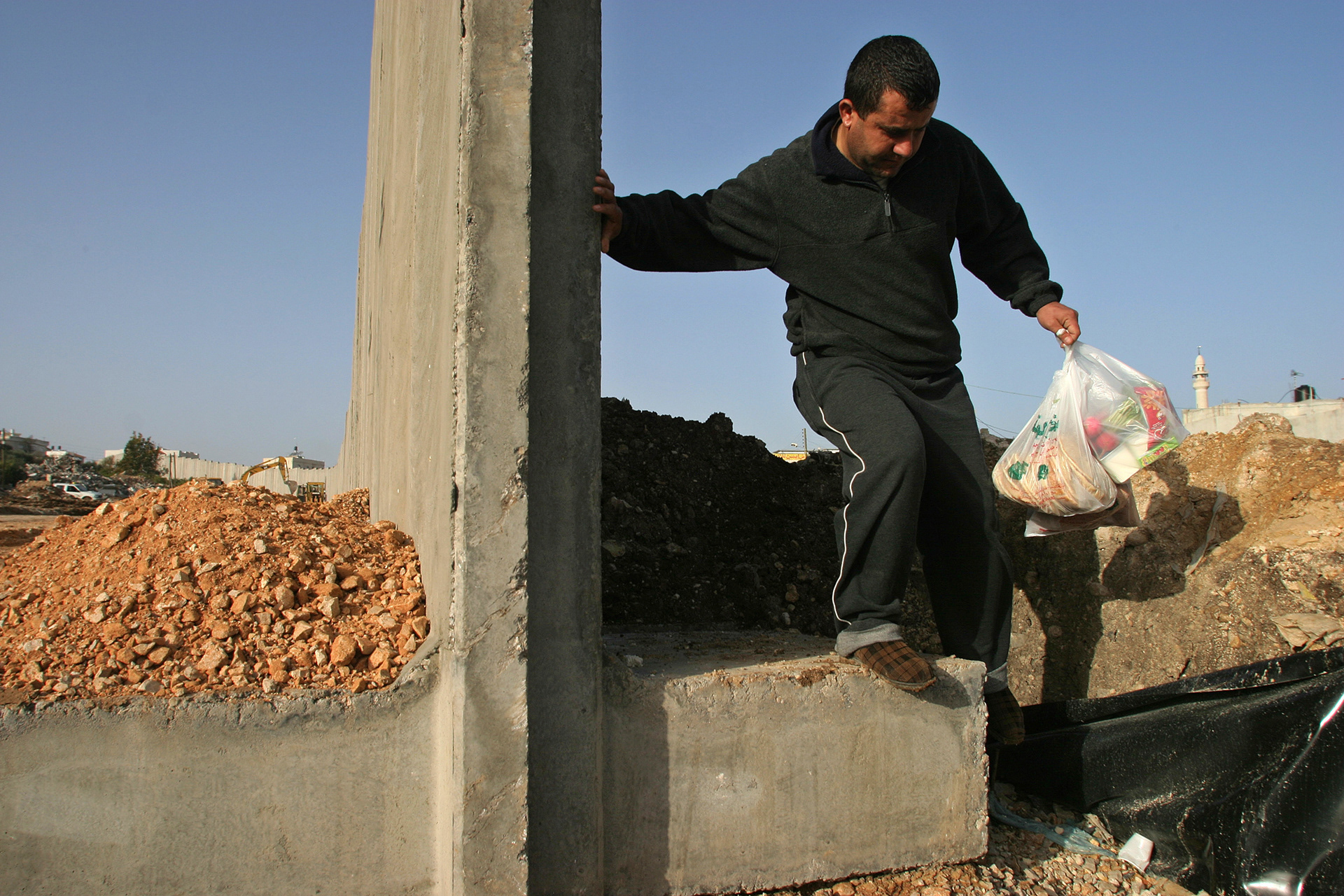 going around an unfinished section of the wall, Qalqilya, Palestine, December 2003