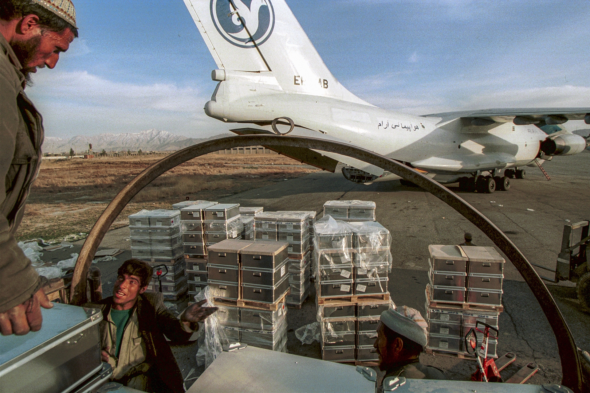 "School-in-a-box" education kits are delivered for the return to school in 2002