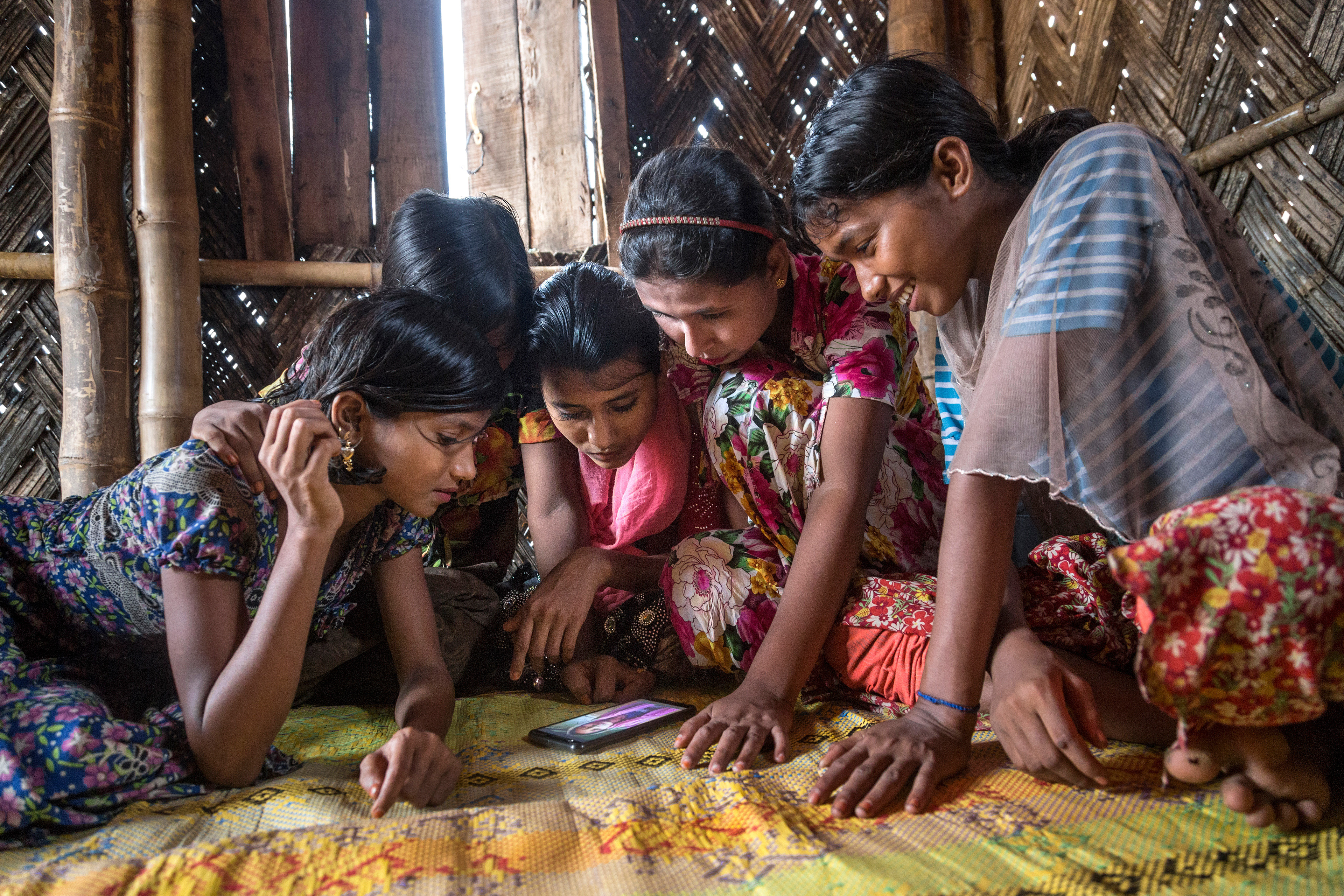Rohingya girls play in a UNICEF Child Friendly Space, one year after their arrival, Bangladesh, 2018