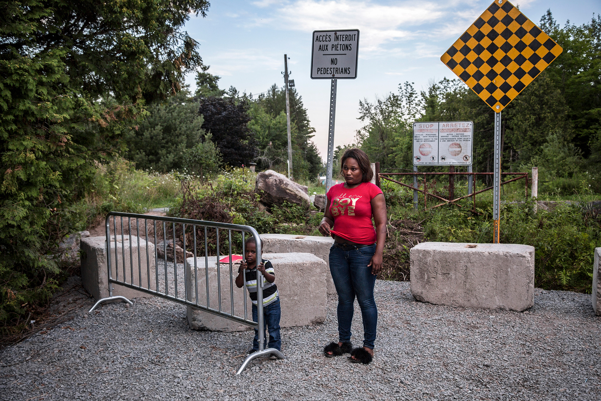 Asylum seekers at an illegal crossing point on the Canada-US border, Quebec, 2018