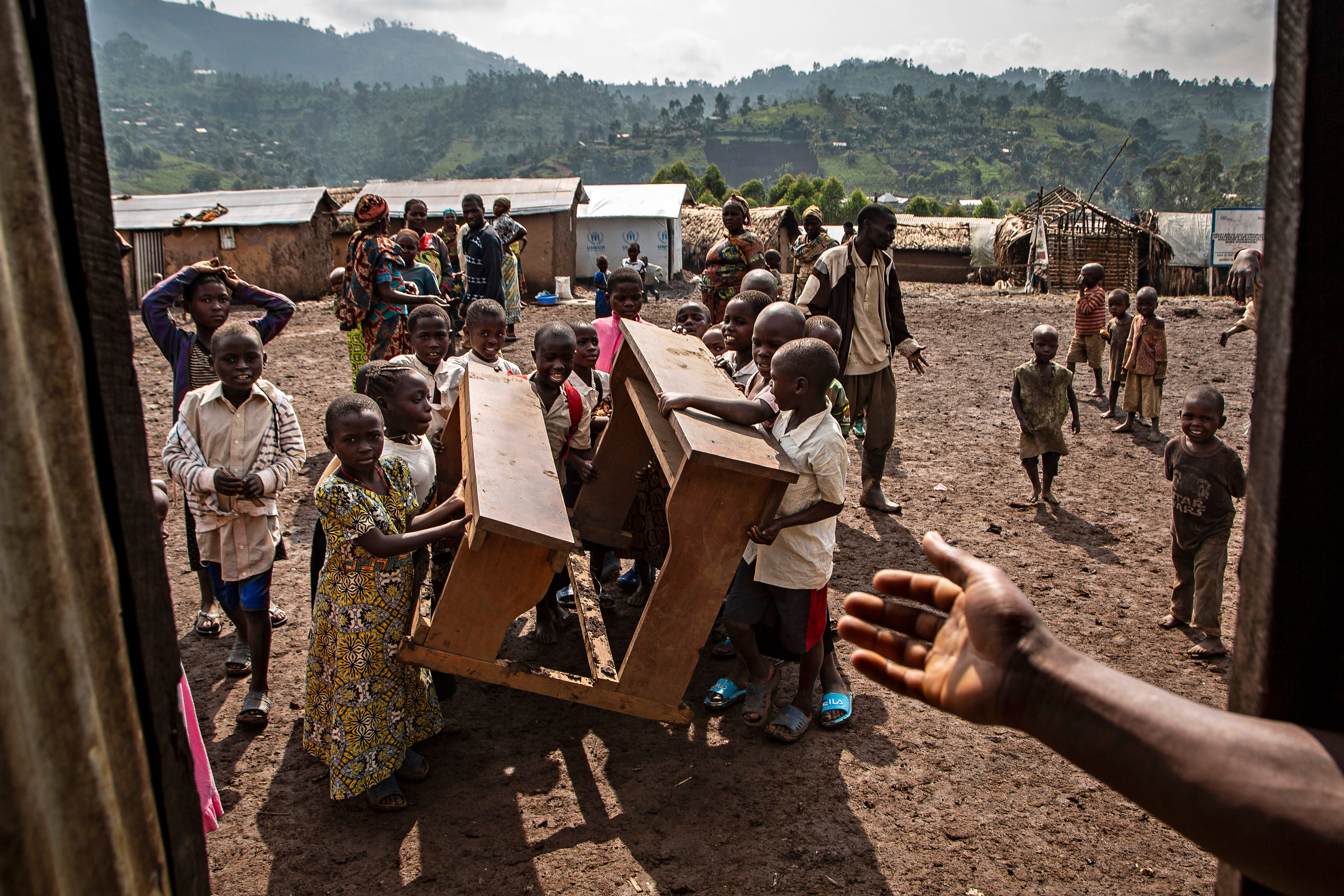  In a camp for people displaced by conflict in Mweso,  North-Kivu, children return to class at École la Bénédiction.