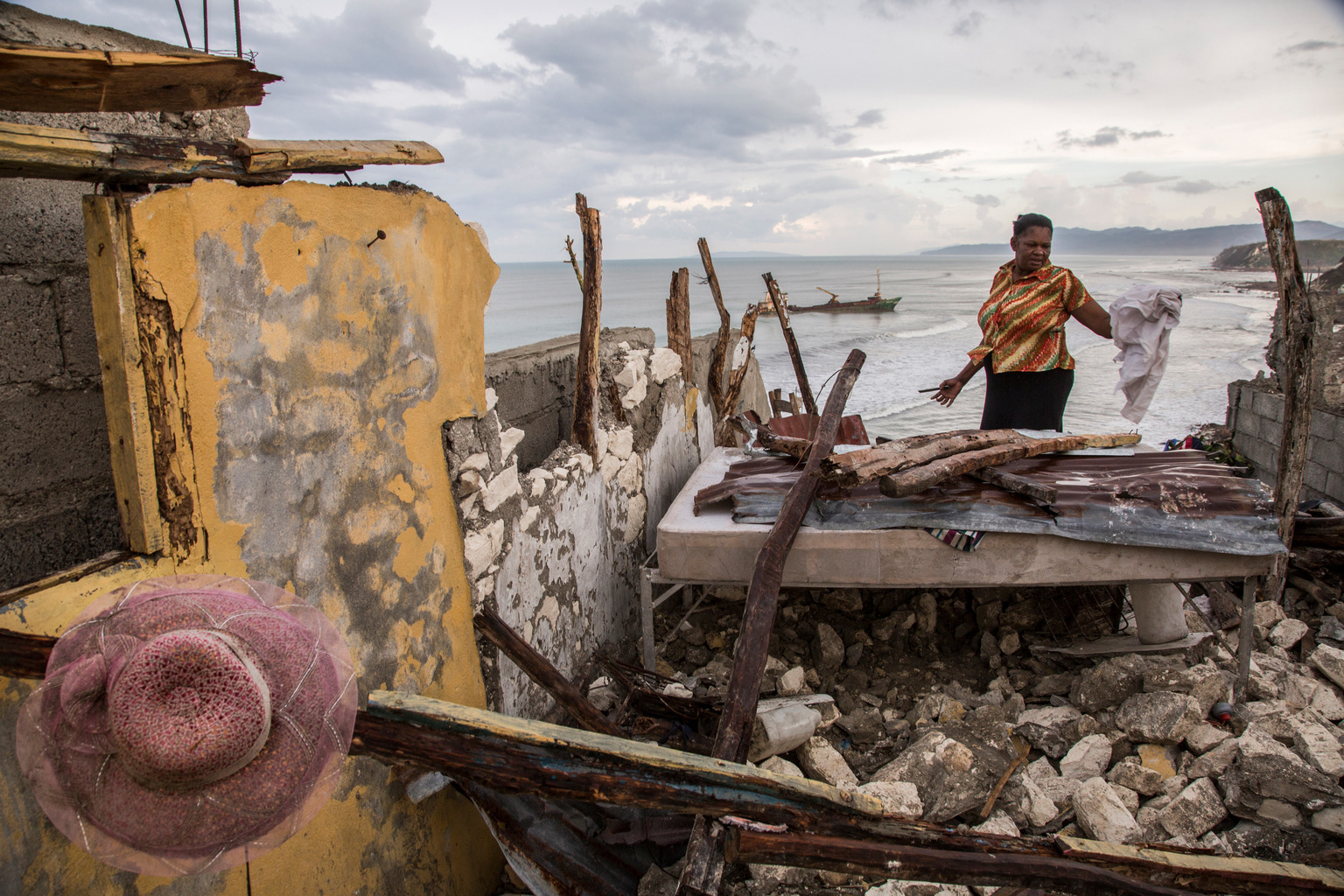 Jérémie, Haiti, 13 October 2016  A woman returns to her destroyed home, after the passage of Hurricane Matthew.