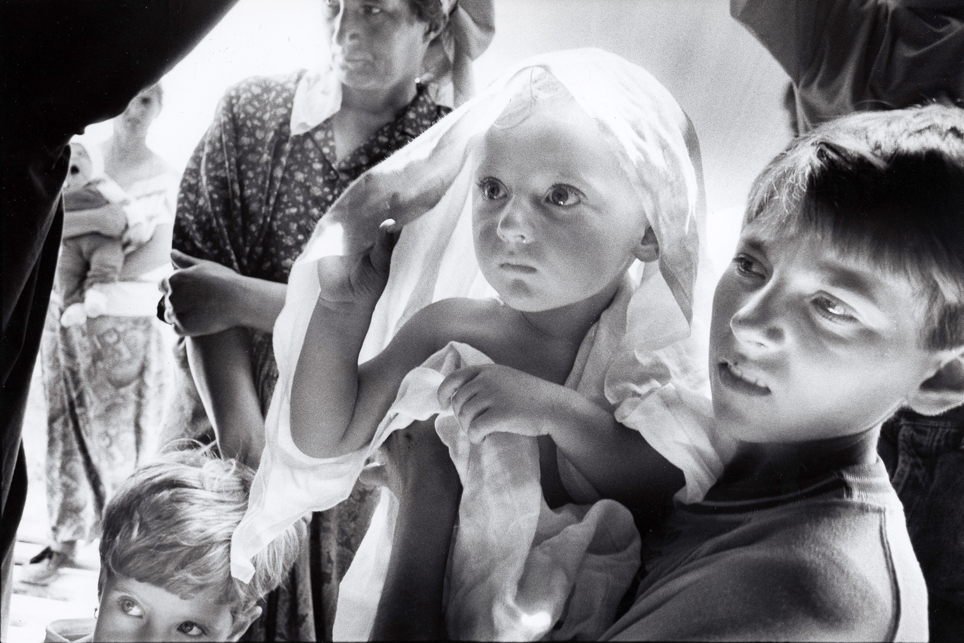 Bosnian IDPs from Srebrenica visit a UNICEF tent for baby care. Dubrave, Bosnia, July 1995