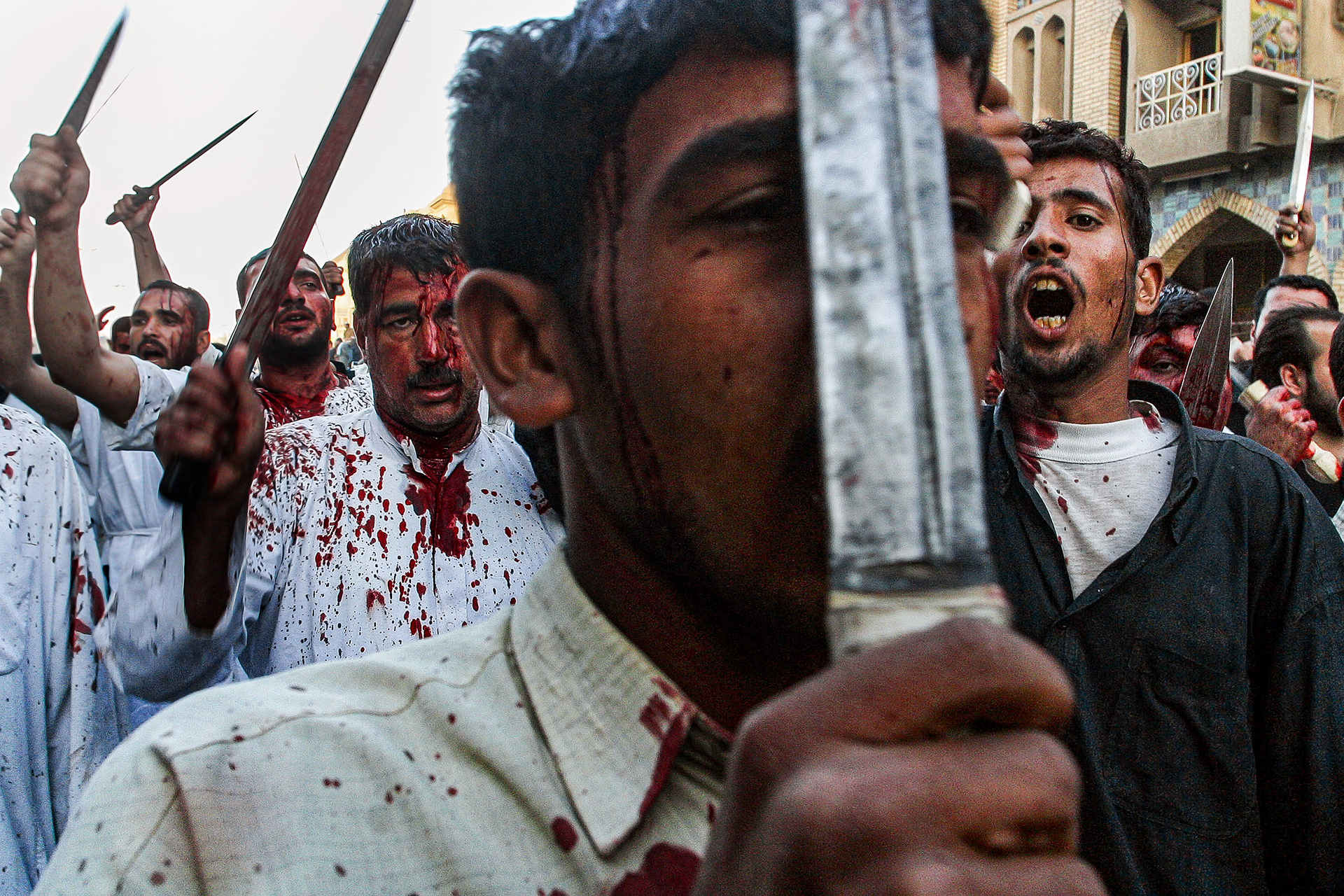 Shia Iraqis celebrate the martyrdom of Imam Ali in Karbala, Iraq. April 2003
