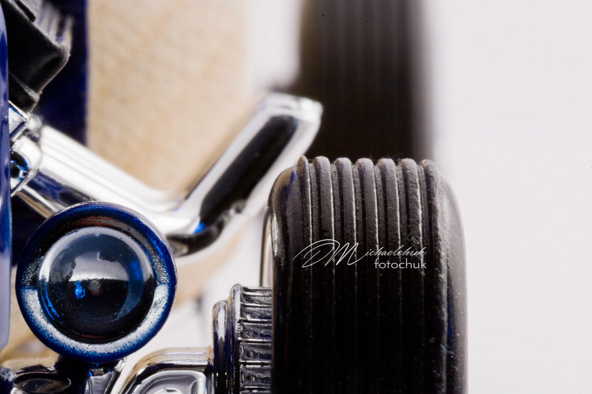 This was my first shoot with a real macro lens.  It was inspired and composed for the “from every angle” monthly project at photoblogchallenges.com.  The subject in this series, Automoblox truck and hot rod , has got to be one of the coolest toys ever.  I would almost have to say its right up there with Lego.  My son will play with just these two vehicles for hours.The shoot itself was very interesting.  I had a real challenge getting the lighting and background just right.  Over the course of an evening, I ended up building my own light box out of a beer case, white paper and scotch tape and a 2000watt halogen.  It worked surprisingly well.