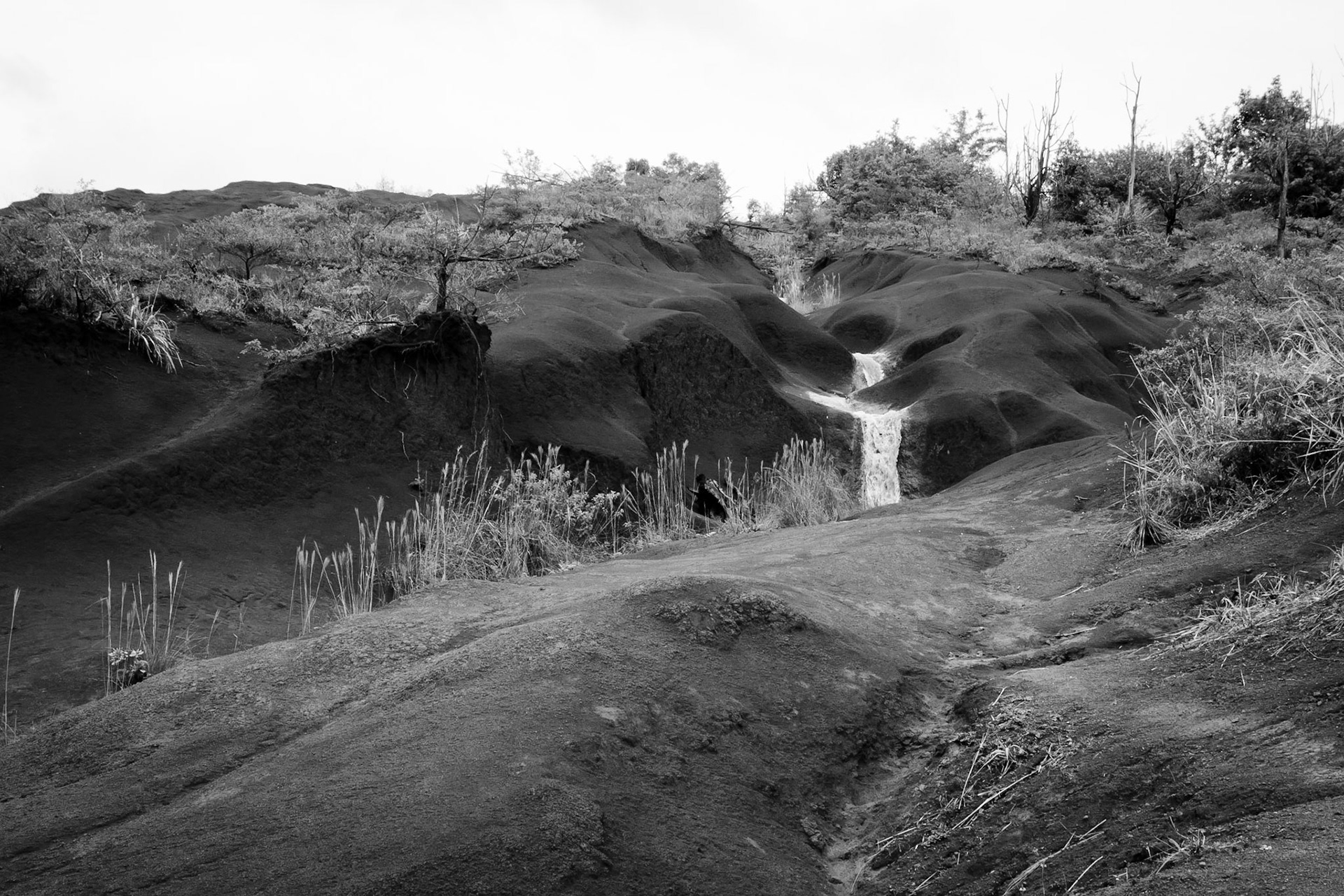 This amazing landscape of rolling rock formations with water cutting through it is just amazing.  Photo was taken in Kauai.