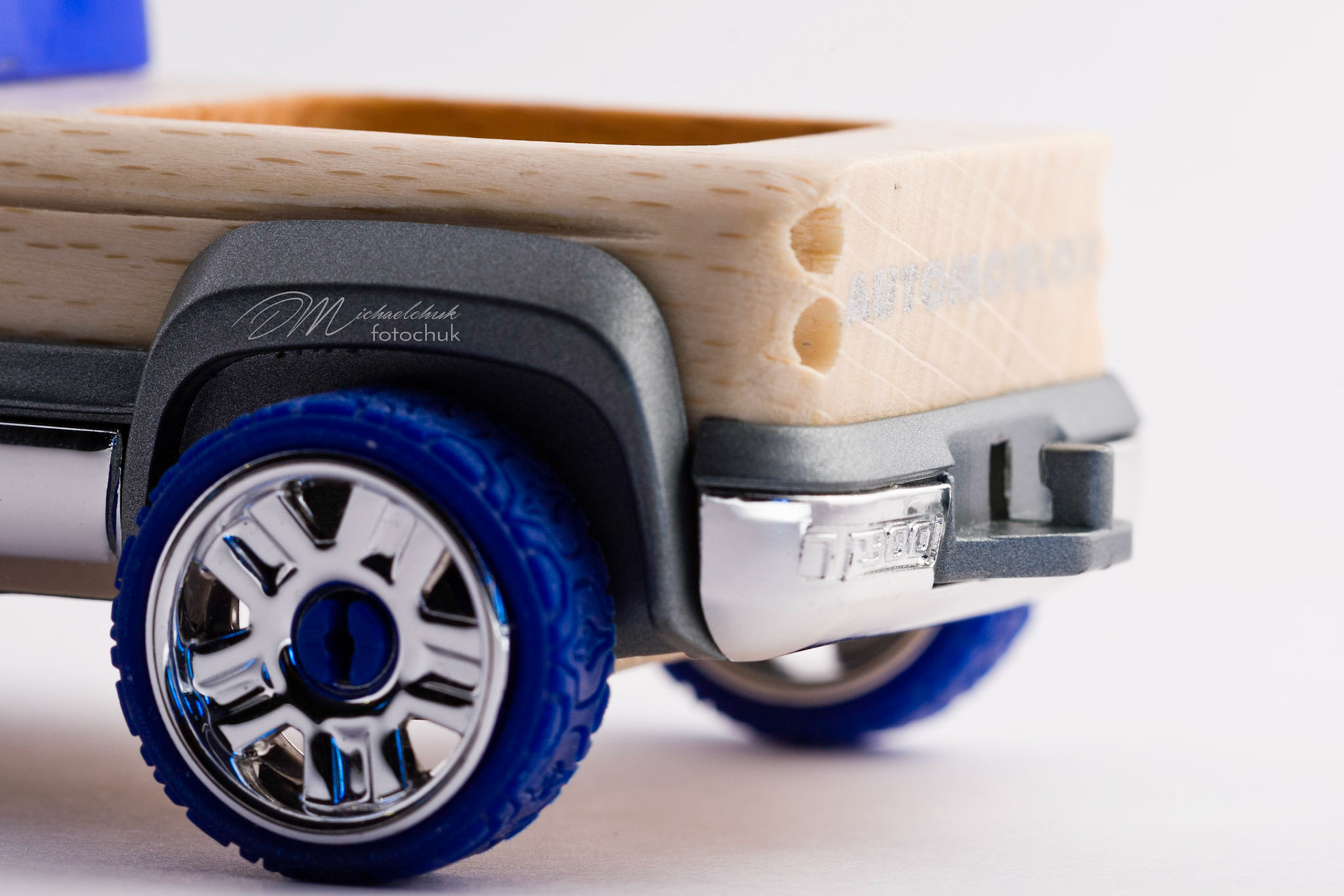 This was my first shoot with a real macro lens.  It was inspired and composed for the “from every angle” monthly project at photoblogchallenges.com.  The subject in this series, Automoblox truck and hot rod , has got to be one of the coolest toys ever.  I would almost have to say its right up there with Lego.  My son will play with just these two vehicles for hours.The shoot itself was very interesting.  I had a real challenge getting the lighting and background just right.  Over the course of an evening, I ended up building my own light box out of a beer case, white paper and scotch tape and a 2000watt halogen.  It worked surprisingly well.