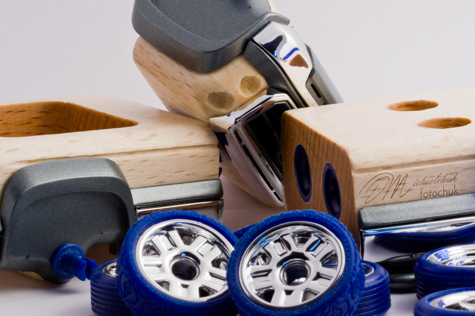 This was my first shoot with a real macro lens.  It was inspired and composed for the “from every angle” monthly project at photoblogchallenges.com.  The subject in this series, Automoblox truck and hot rod , has got to be one of the coolest toys ever.  I would almost have to say its right up there with Lego.  My son will play with just these two vehicles for hours.The shoot itself was very interesting.  I had a real challenge getting the lighting and background just right.  Over the course of an evening, I ended up building my own light box out of a beer case, white paper and scotch tape and a 2000watt halogen.  It worked surprisingly well.