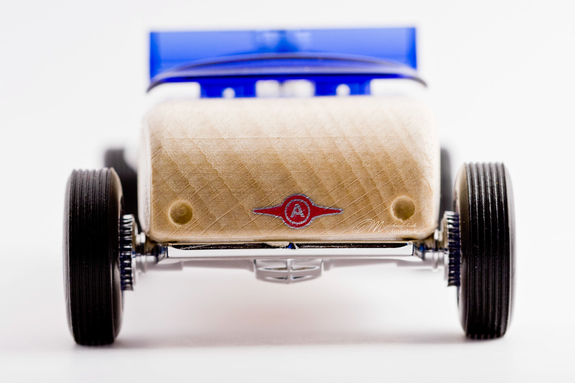This was my first shoot with a real macro lens.  It was inspired and composed for the “from every angle” monthly project at photoblogchallenges.com.  The subject in this series, Automoblox truck and hot rod , has got to be one of the coolest toys ever.  I would almost have to say its right up there with Lego.  My son will play with just these two vehicles for hours.The shoot itself was very interesting.  I had a real challenge getting the lighting and background just right.  Over the course of an evening, I ended up building my own light box out of a beer case, white paper and scotch tape and a 2000watt halogen.  It worked surprisingly well.