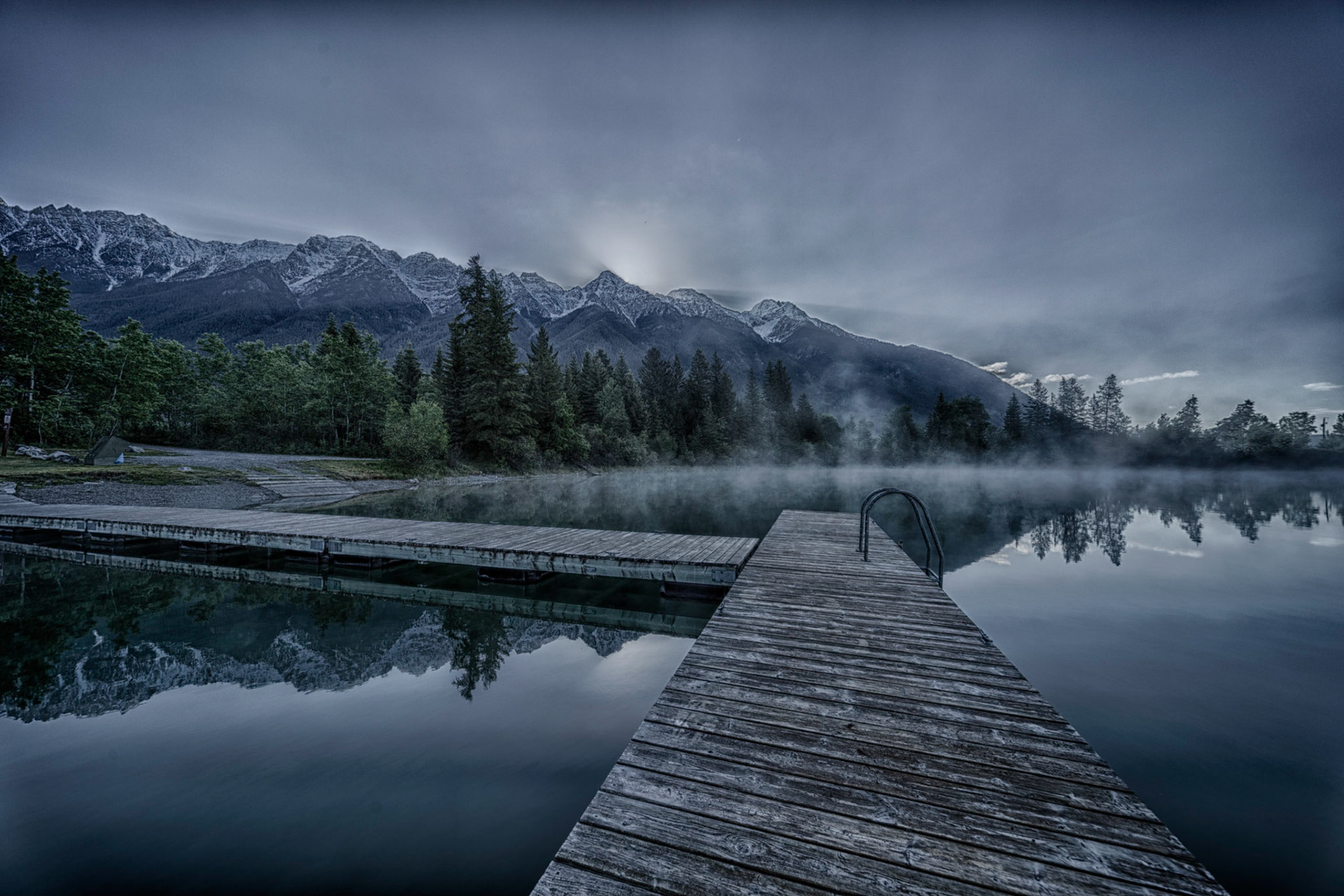 Cool spring morning as the sun comes over The Steeples on Norbury Lake.