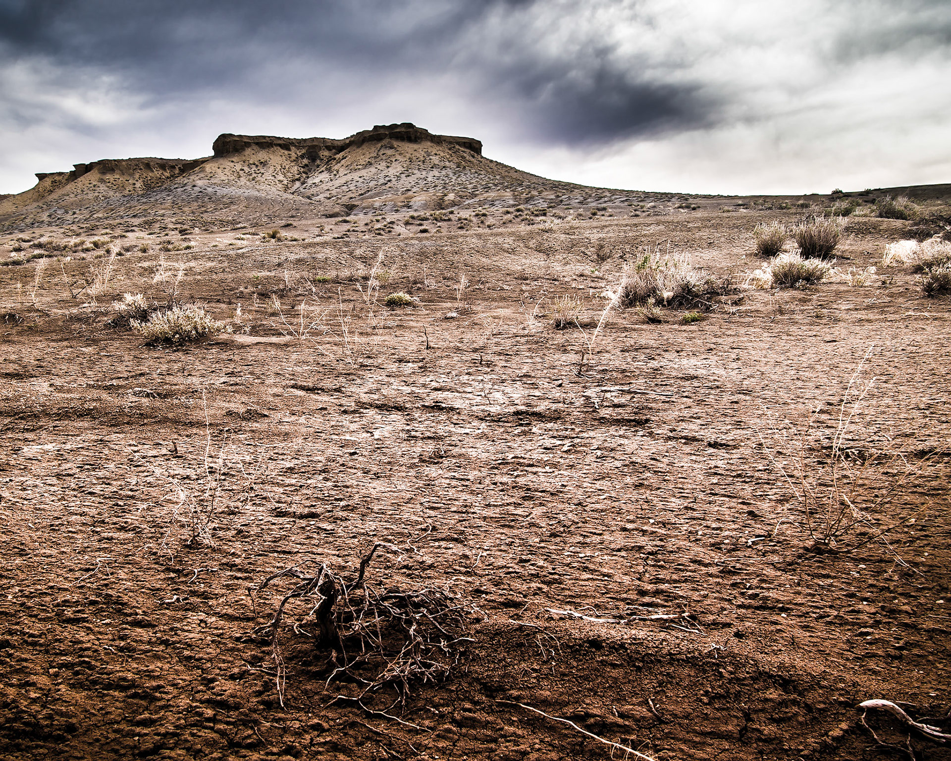 This is a monochrome shot near Coalmine Canyon in Arizona.  As a color image it was rather flat, but processed in color this time and it still looks gloomy.