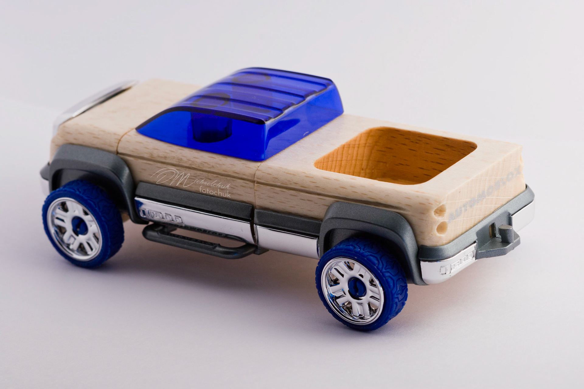 This was my first shoot with a real macro lens.  It was inspired and composed for the “from every angle” monthly project at photoblogchallenges.com.  The subject in this series, Automoblox truck and hot rod , has got to be one of the coolest toys ever.  I would almost have to say its right up there with Lego.  My son will play with just these two vehicles for hours.The shoot itself was very interesting.  I had a real challenge getting the lighting and background just right.  Over the course of an evening, I ended up building my own light box out of a beer case, white paper and scotch tape and a 2000watt halogen.  It worked surprisingly well.