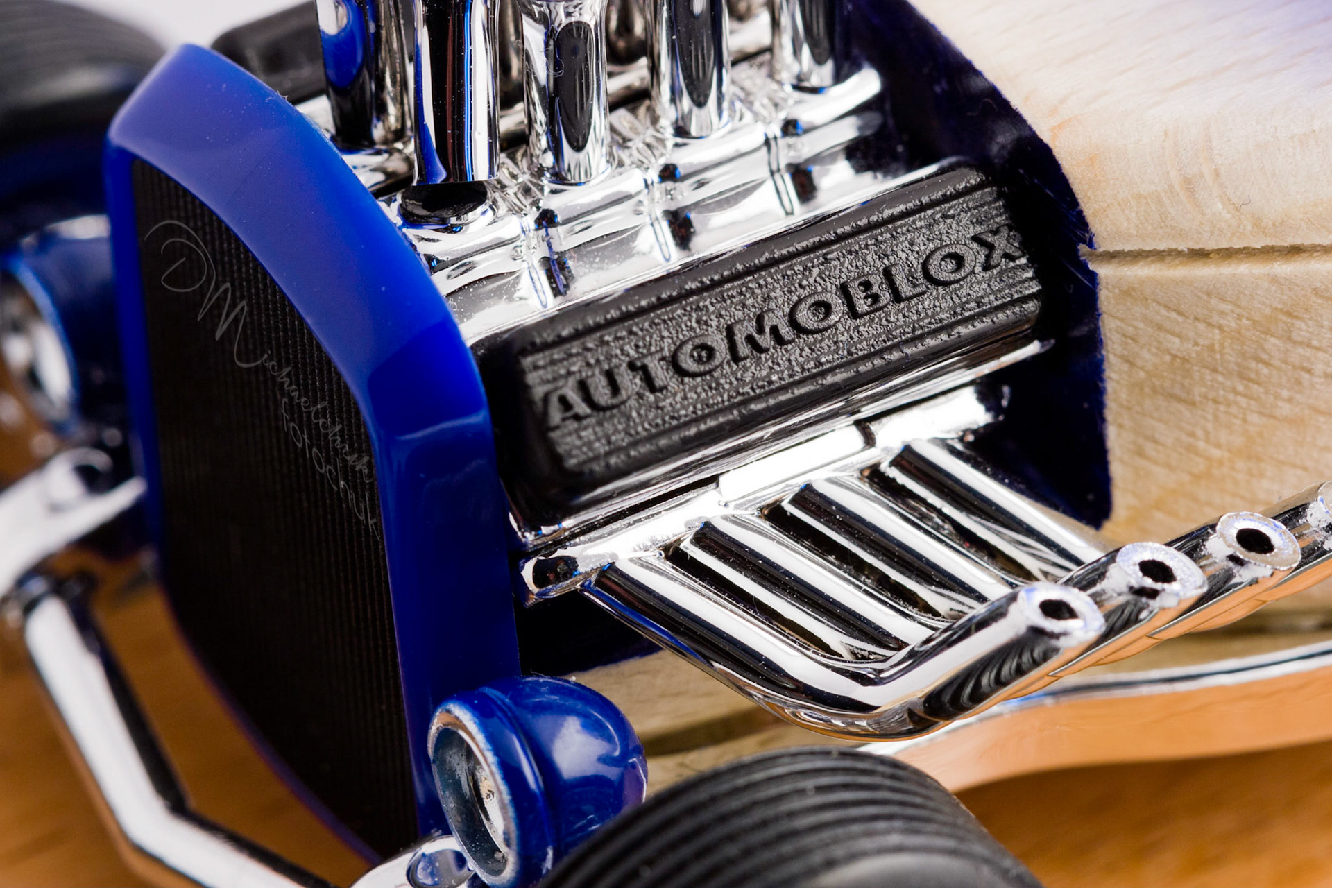 This was my first shoot with a real macro lens.  It was inspired and composed for the “from every angle” monthly project at photoblogchallenges.com.  The subject in this series, Automoblox truck and hot rod , has got to be one of the coolest toys ever.  I would almost have to say its right up there with Lego.  My son will play with just these two vehicles for hours.The shoot itself was very interesting.  I had a real challenge getting the lighting and background just right.  Over the course of an evening, I ended up building my own light box out of a beer case, white paper and scotch tape and a 2000watt halogen.  It worked surprisingly well.