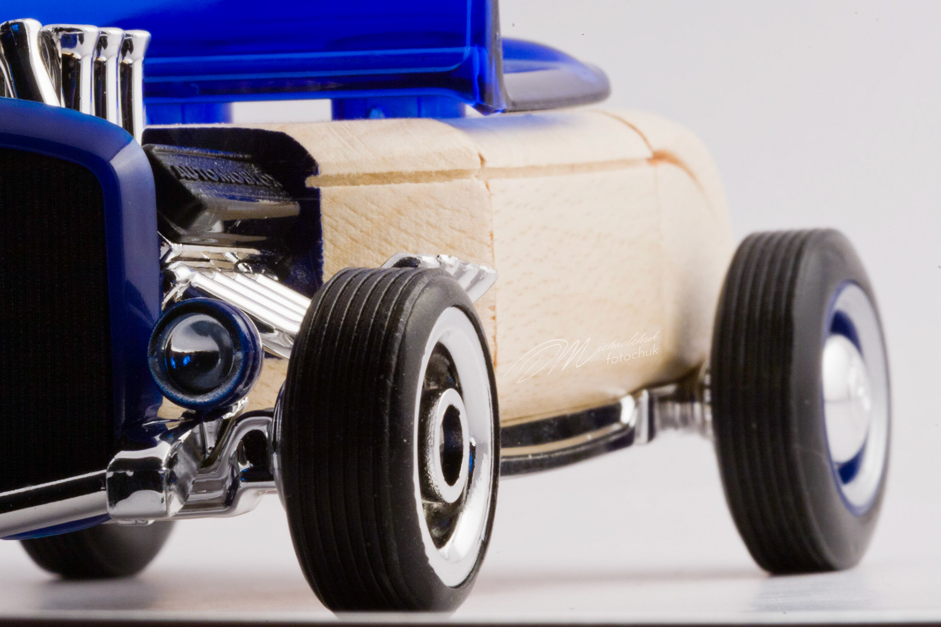 This was my first shoot with a real macro lens.  It was inspired and composed for the “from every angle” monthly project at photoblogchallenges.com.  The subject in this series, Automoblox truck and hot rod , has got to be one of the coolest toys ever.  I would almost have to say its right up there with Lego.  My son will play with just these two vehicles for hours.The shoot itself was very interesting.  I had a real challenge getting the lighting and background just right.  Over the course of an evening, I ended up building my own light box out of a beer case, white paper and scotch tape and a 2000watt halogen.  It worked surprisingly well.