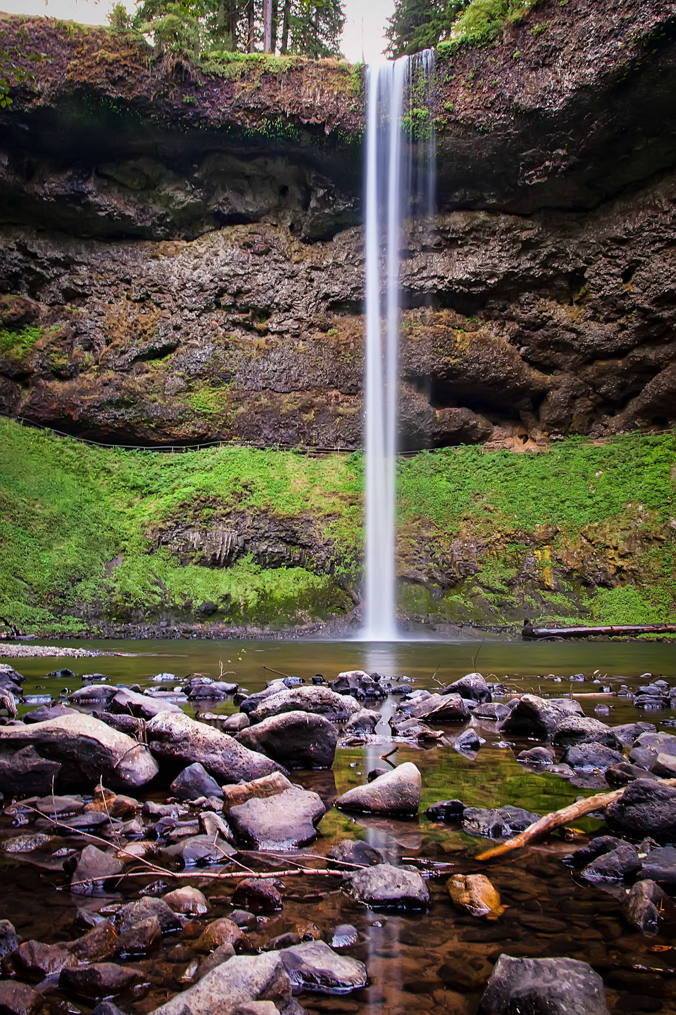 With its reflection amongst the rocks, these are the south silver falls in Oregon.