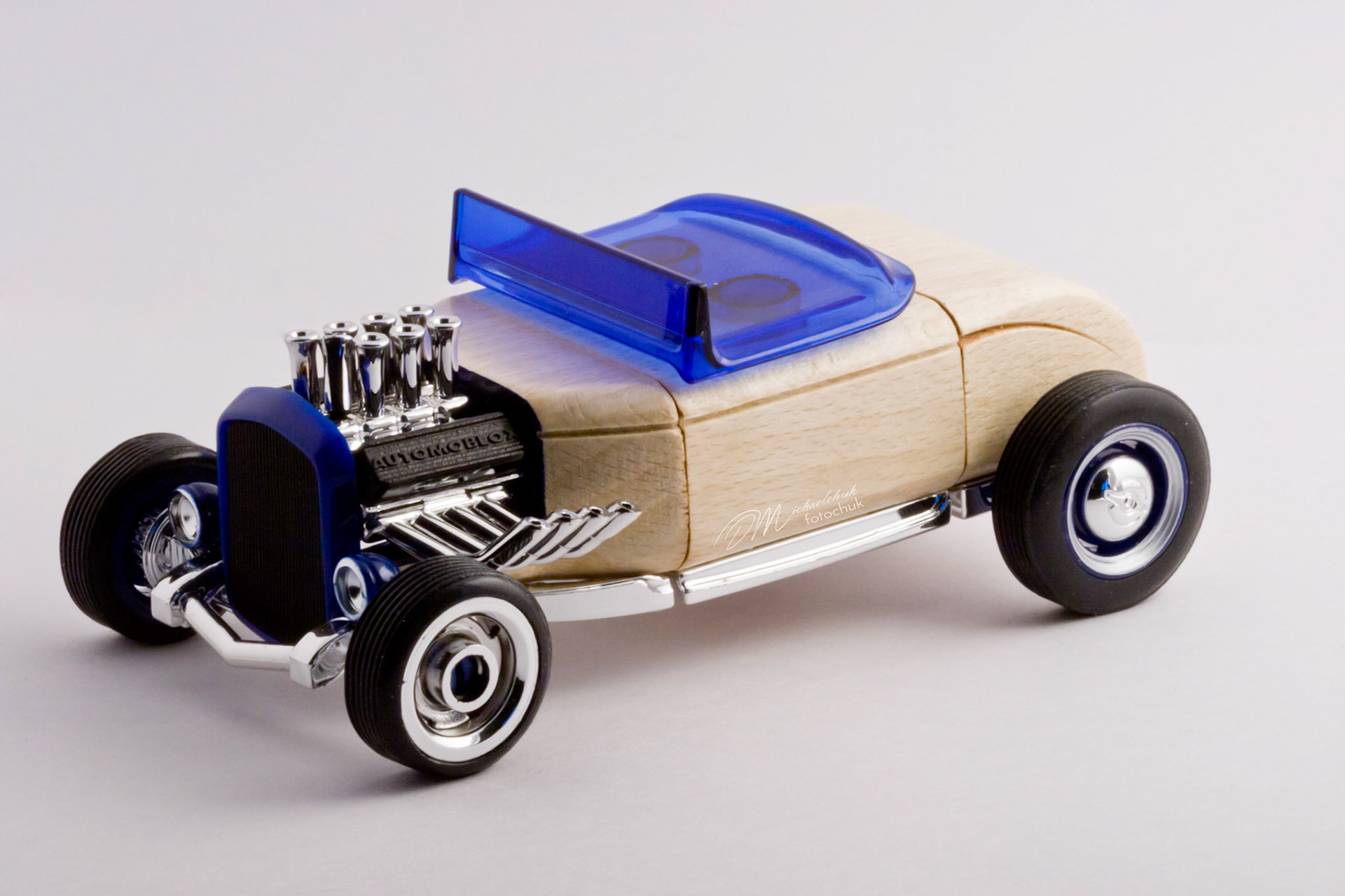 This was my first shoot with a real macro lens.  It was inspired and composed for the “from every angle” monthly project at photoblogchallenges.com.  The subject in this series, Automoblox truck and hot rod , has got to be one of the coolest toys ever.  I would almost have to say its right up there with Lego.  My son will play with just these two vehicles for hours.The shoot itself was very interesting.  I had a real challenge getting the lighting and background just right.  Over the course of an evening, I ended up building my own light box out of a beer case, white paper and scotch tape and a 2000watt halogen.  It worked surprisingly well.