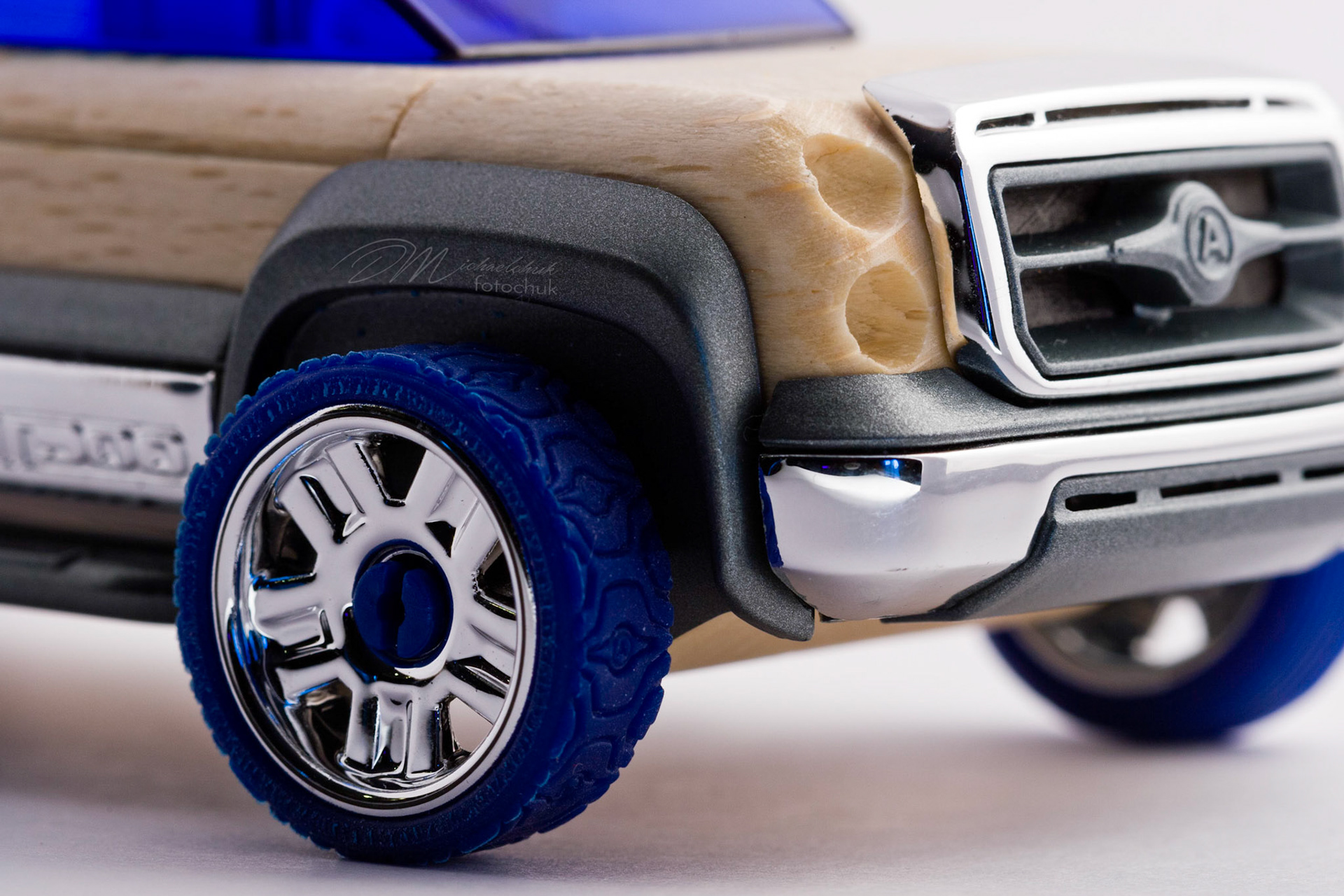 This was my first shoot with a real macro lens.  It was inspired and composed for the “from every angle” monthly project at photoblogchallenges.com.  The subject in this series, Automoblox truck and hot rod , has got to be one of the coolest toys ever.  I would almost have to say its right up there with Lego.  My son will play with just these two vehicles for hours.The shoot itself was very interesting.  I had a real challenge getting the lighting and background just right.  Over the course of an evening, I ended up building my own light box out of a beer case, white paper and scotch tape and a 2000watt halogen.  It worked surprisingly well.