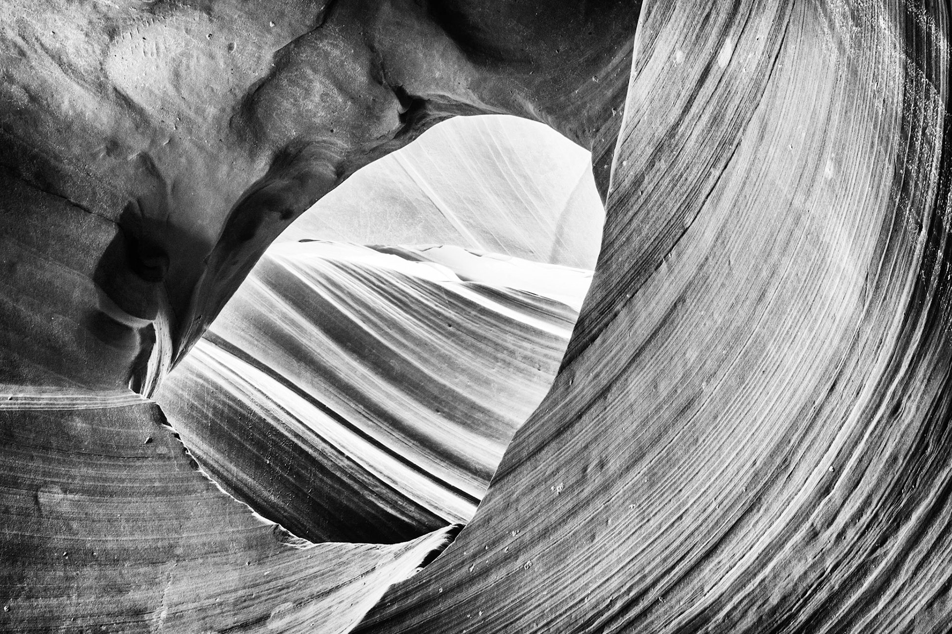 Processed in black and white, the Eye of the Eagle shines as it is backlit in South Antelope Canyon.