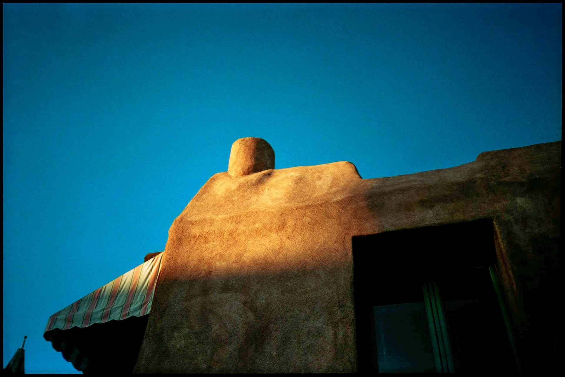 Sun setting on an Adobe building in New Mexico 1993