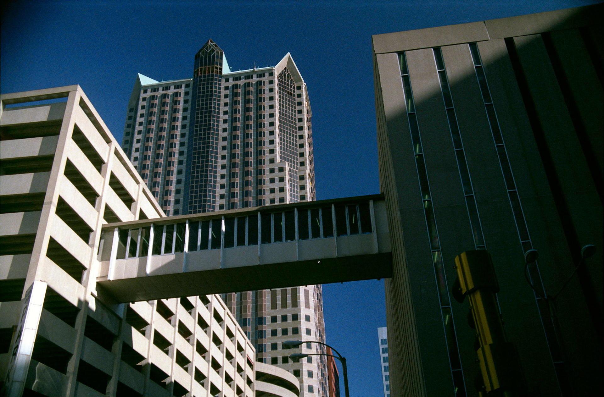 A walkway connecting an office building and a parking garage. Part of a series shot one afternoon in November, 1988 called An Afternoon in St. Louis (a subset of my Industrial Geometry series).