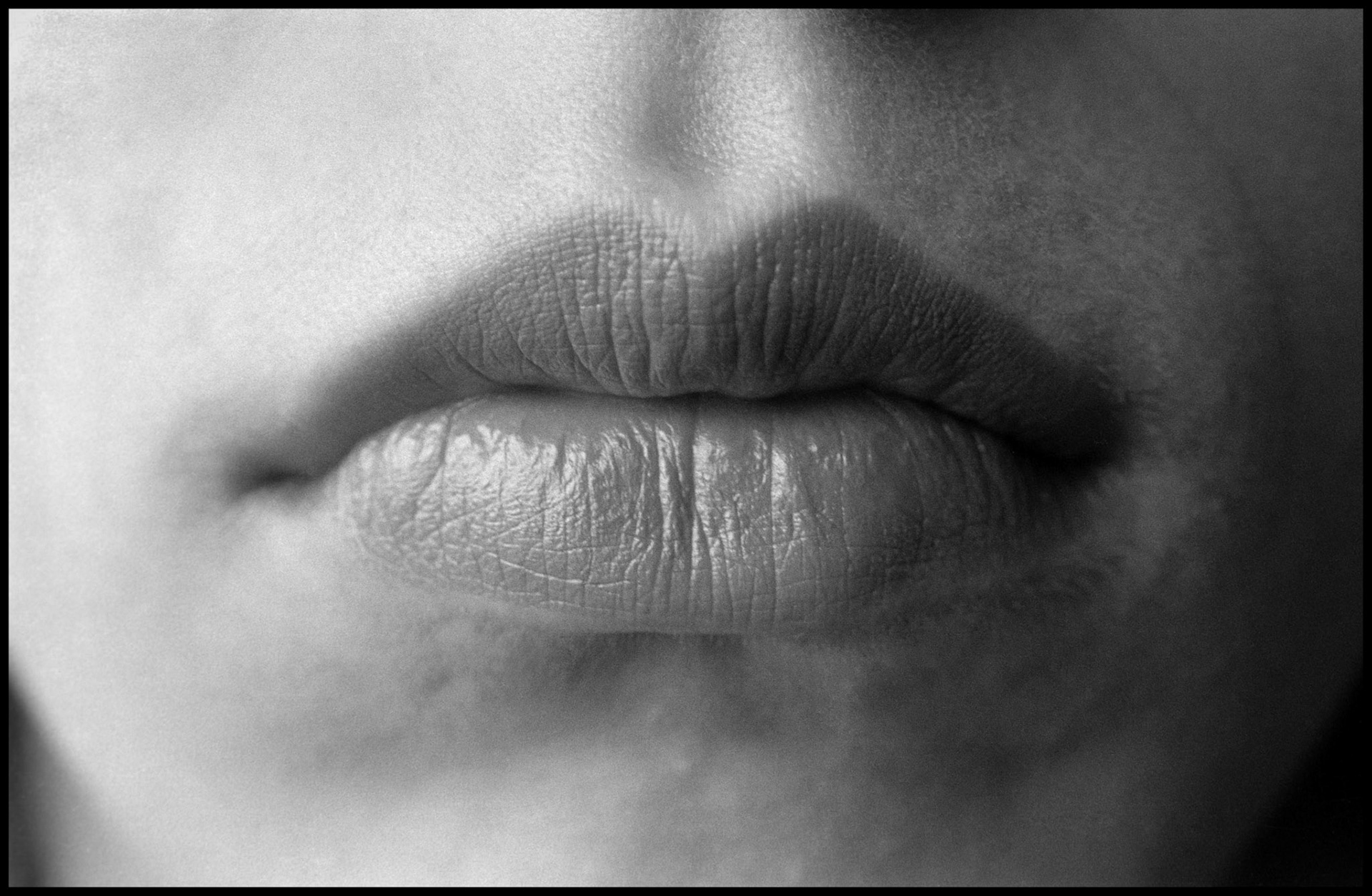 A close up of a woman's full lips in black and white. Kirksville, Missouri 1980
