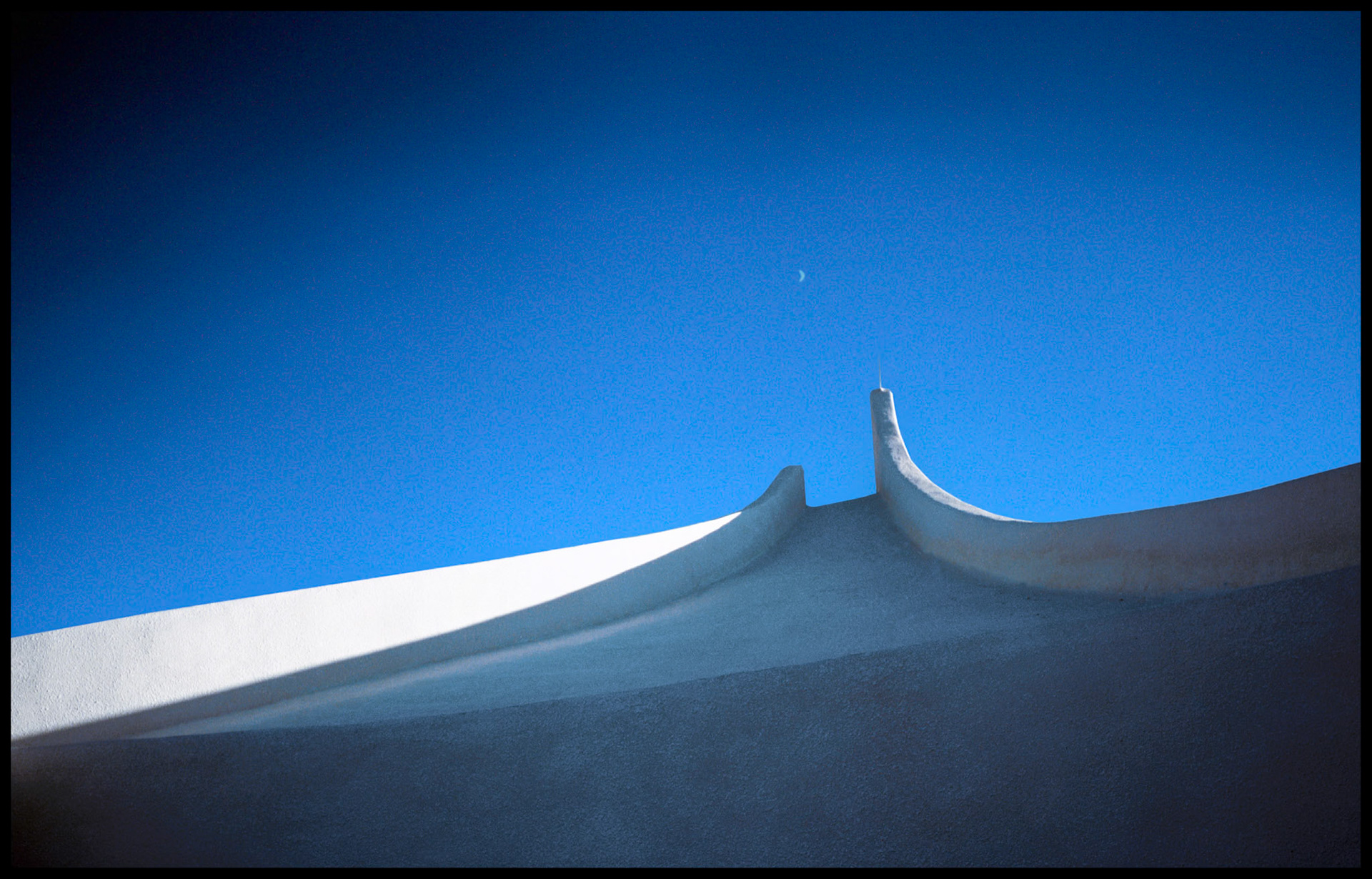 A detail view of the back side of the Vietnam Veterans Memorial building seemingly ascending to the heavens. Near Angel Fire New Mexico, 1993.