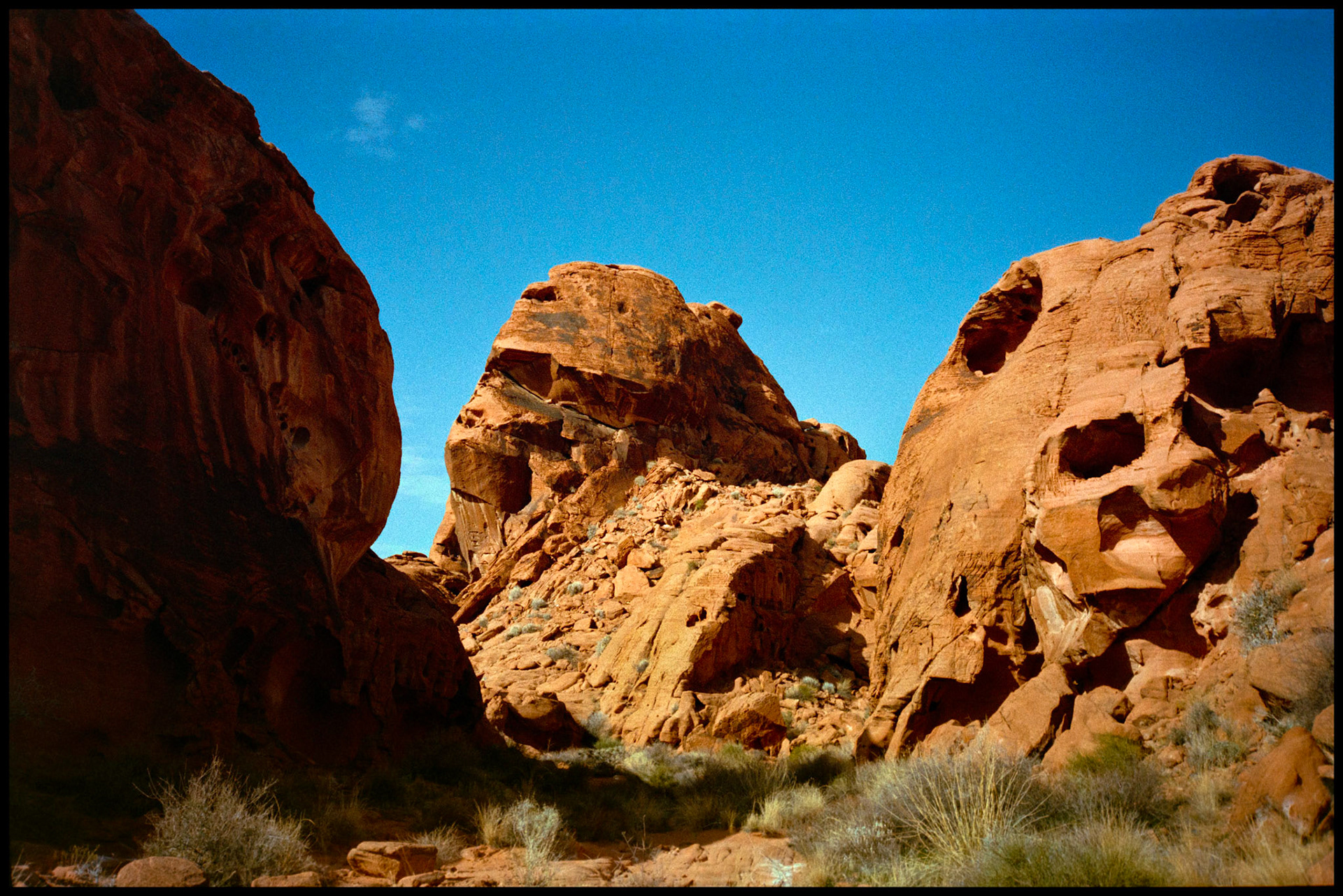 Red rock formations that have an anthropomorphic resemblence to heads of various kinds of goblins/aliens at Valley of Fire State Park near Moapa Valley, Nevada North of Las Vegas. 1992