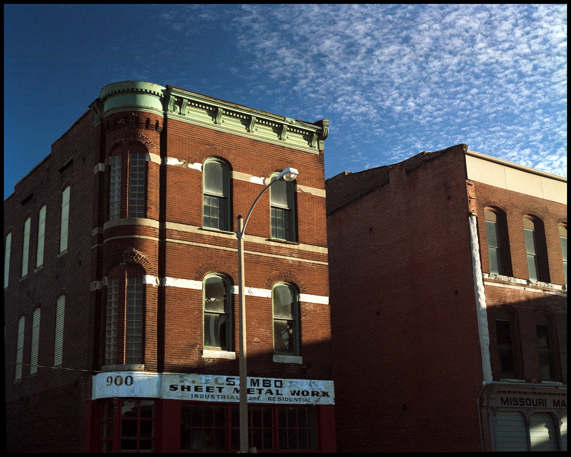 A highlighted commercial building in downtown St. Louis, Missouri. Part of a series shot one afternoon in November, 1988 called An Afternoon in St. Louis (a subset of my Industrial Geometry series).