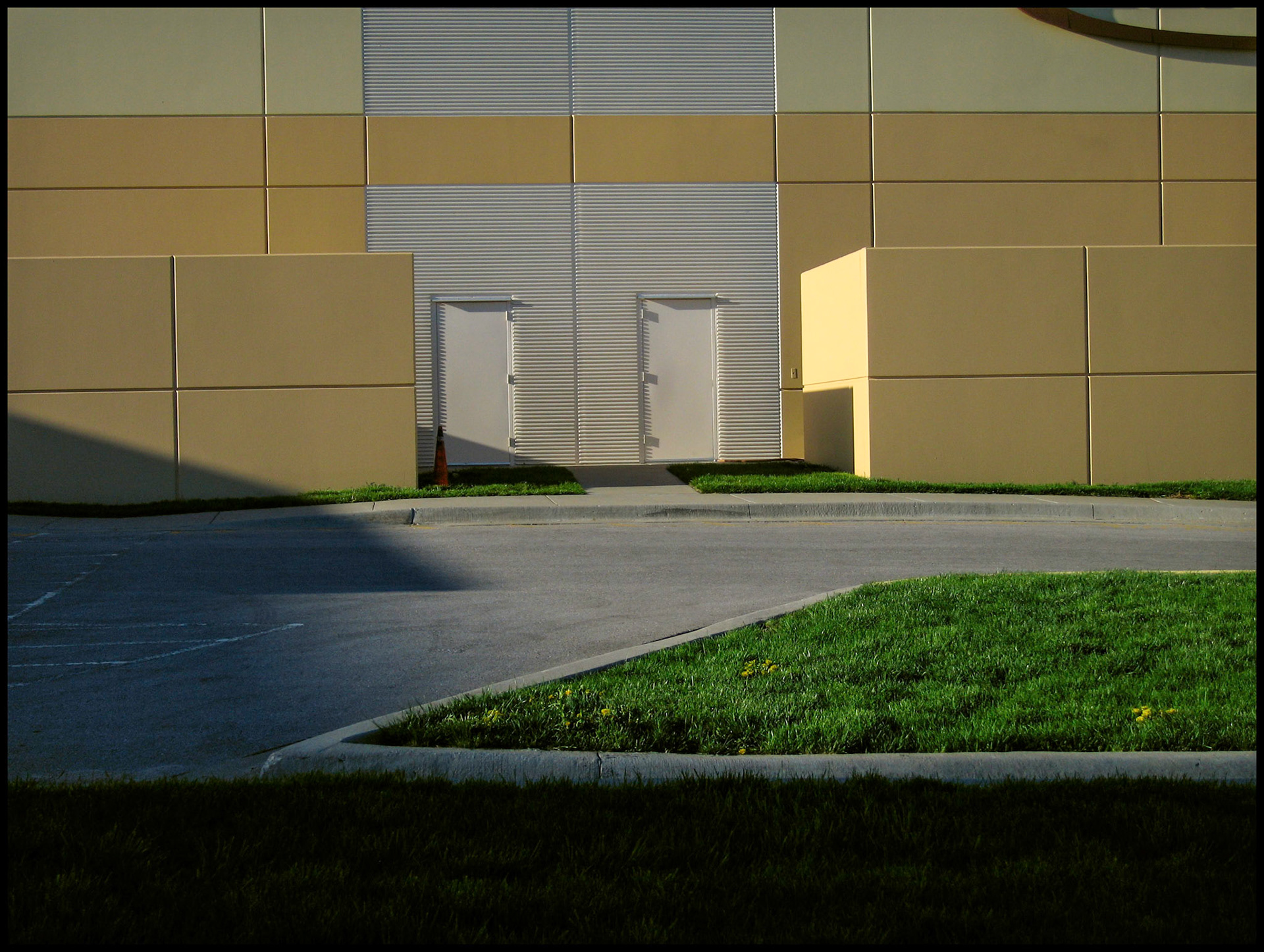 A minimal abstract detail of a dirveway and doors at the KCI Expo Center, Kansas City, Missouri. 2007
