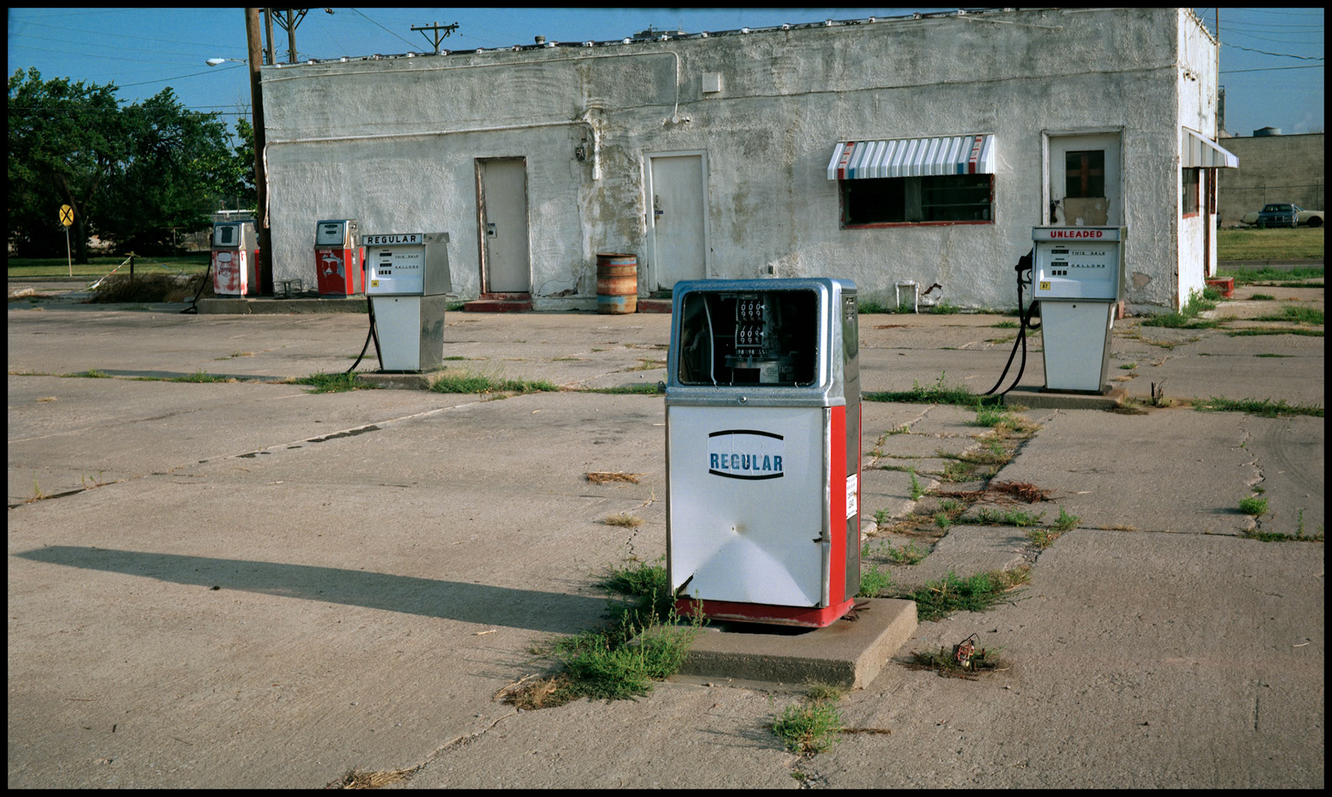 Run down gas pumps at an abandoned gas station in Witchita Kansas. 1991