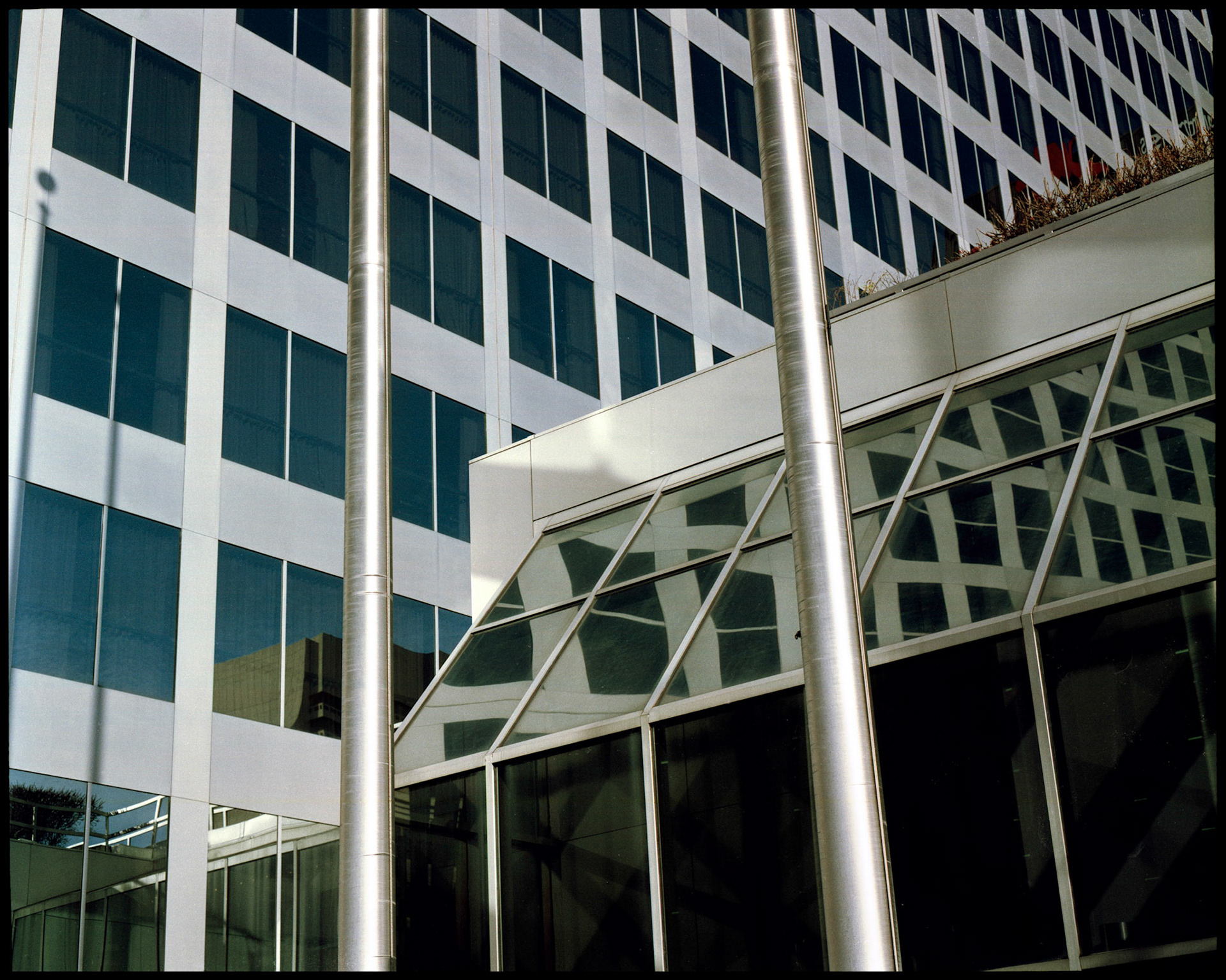 A minimal abstract detail of a downtown St. Louis metal and glass bank building. Part of a series shot one afternoon in November, 1988 called An Afternoon in St. Louis (a subset of my Industrial Geometry series).