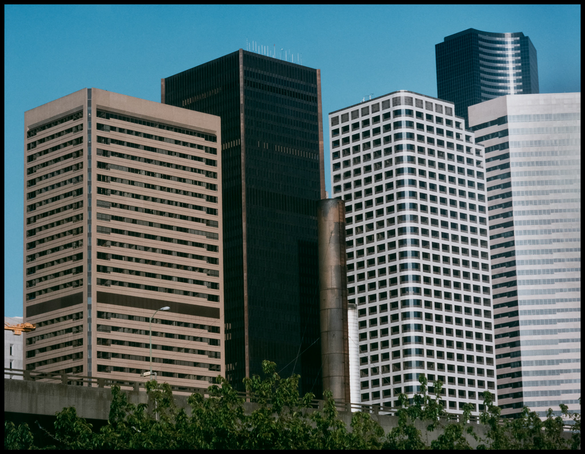 A vintage view of the downtown Seattle architectural skyline taken from the ferry in Puget Sound. Seattle, Washington USA 1987