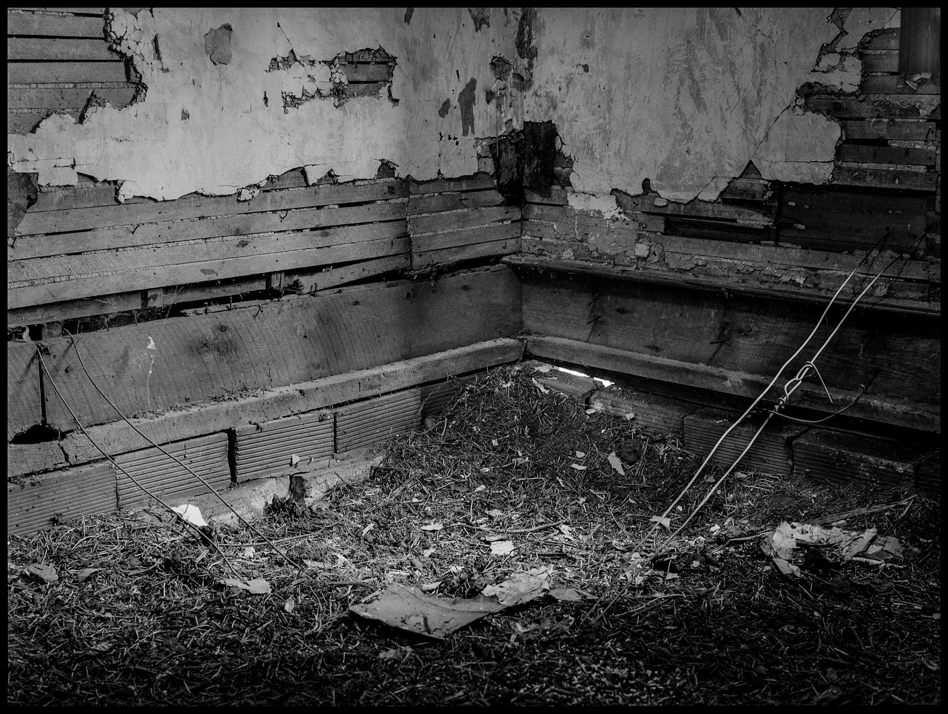 The interior of an abandoned house in an advanced state of decay. Near Pennville, Missouri USA, 1979.