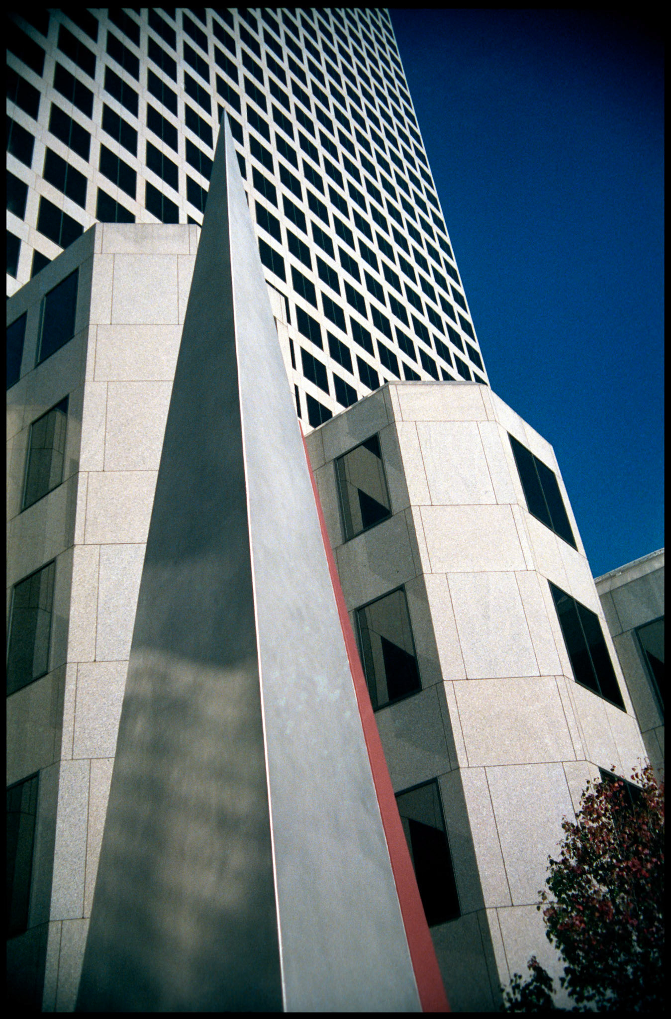 The front of the Southwestern Bell building with towers and a small pyramid in downtown St. Louis, Missouri, 1988. Part of a series shot one warm afternoon in November, 1988 called An Afternoon in St. Louis (a subset of my Industrial Geometry series).