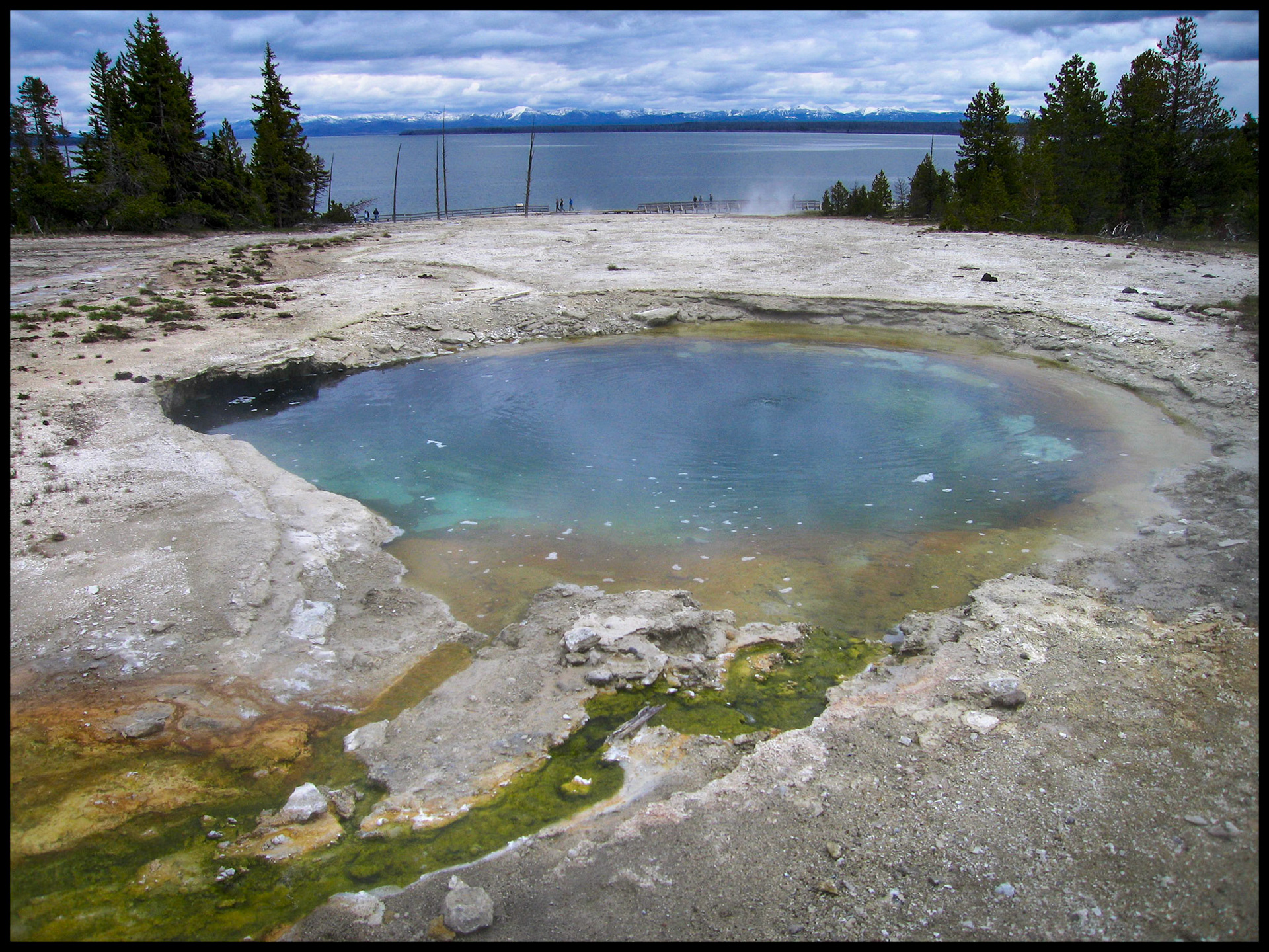 The prismatic colors of Surging Spring in the West Thumb Geyser Basin on the shore of Yellowstone Lake Yellowstone National Park Wyoming USA 2005