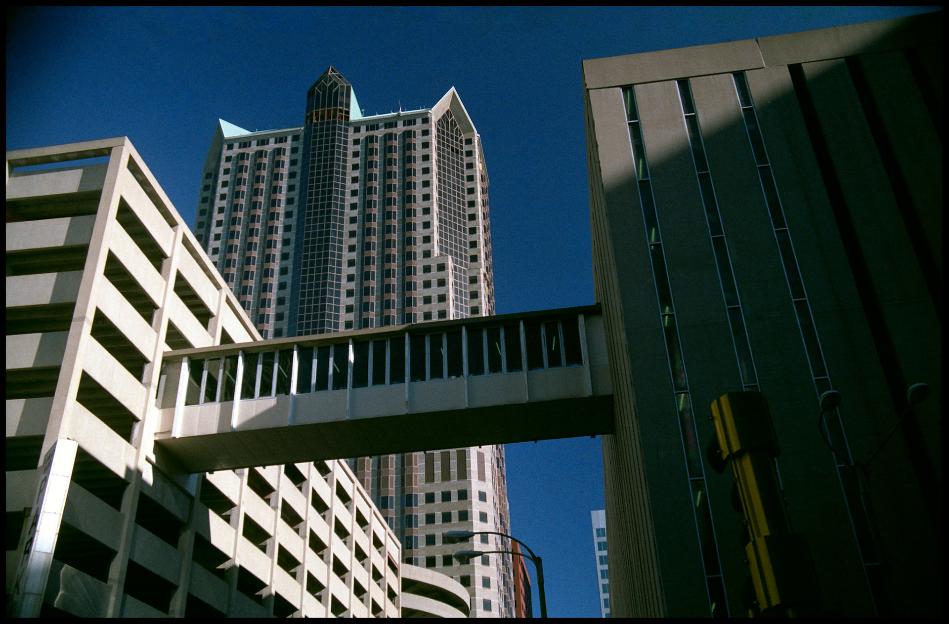 A walkway connecting an office building and a parking garage. Part of a series shot one afternoon in November, 1988 called An Afternoon in St. Louis (a subset of my Industrial Geometry series).