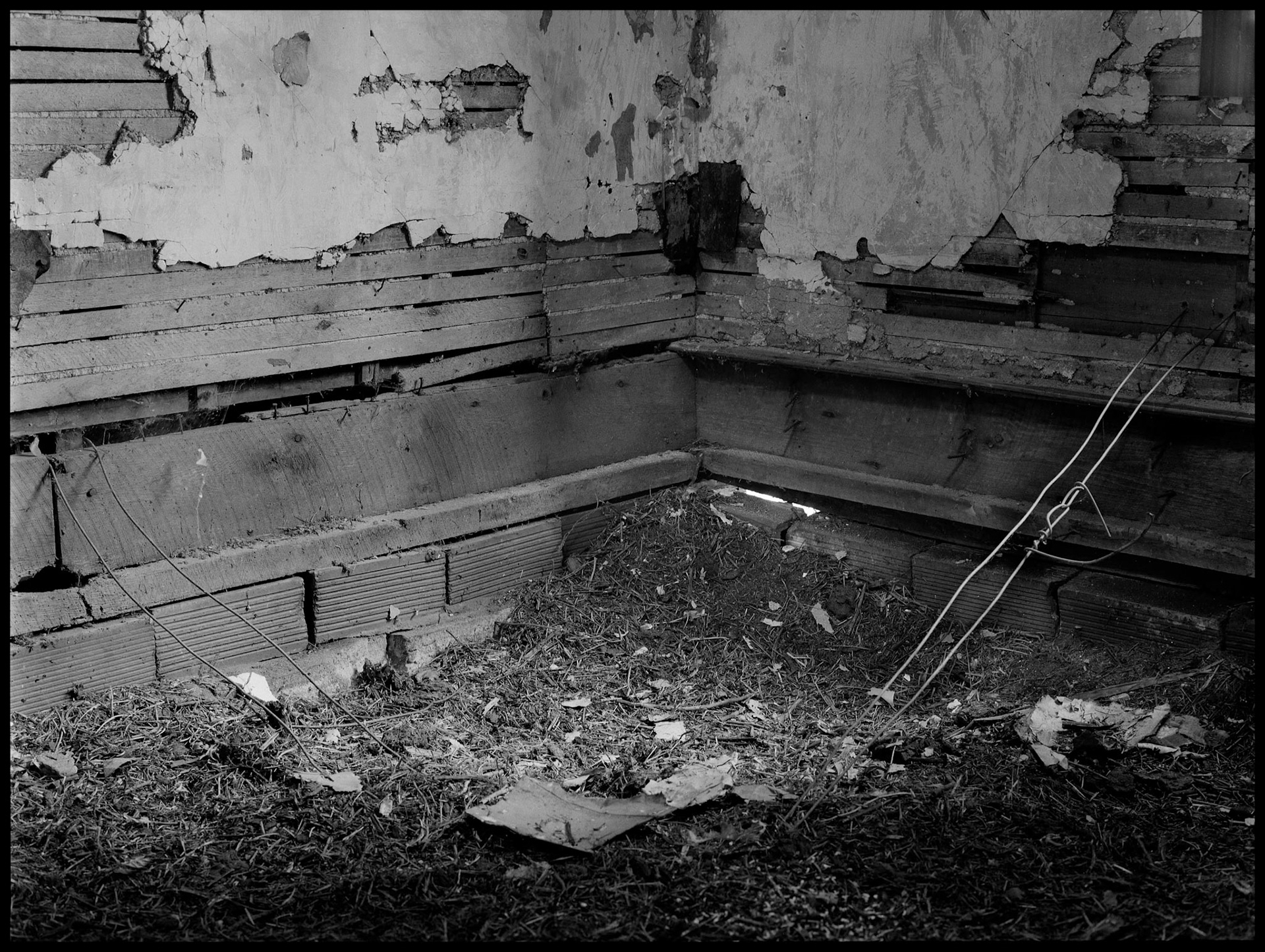 The interior of an abandoned house in an advanced state of decay. Near Pennville, Missouri USA, 1979.