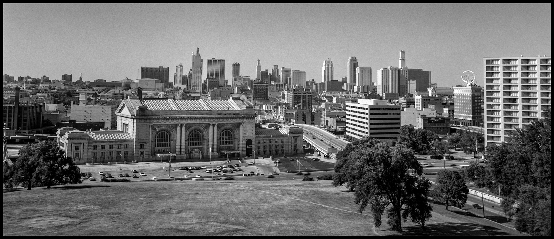 A vintage black and white panoramic view of the historic Union Station and the Kansas City, Missouri skyline as seen from the base of the Liberty Memorial at the National World War One Museum and Memorial Park. 1984