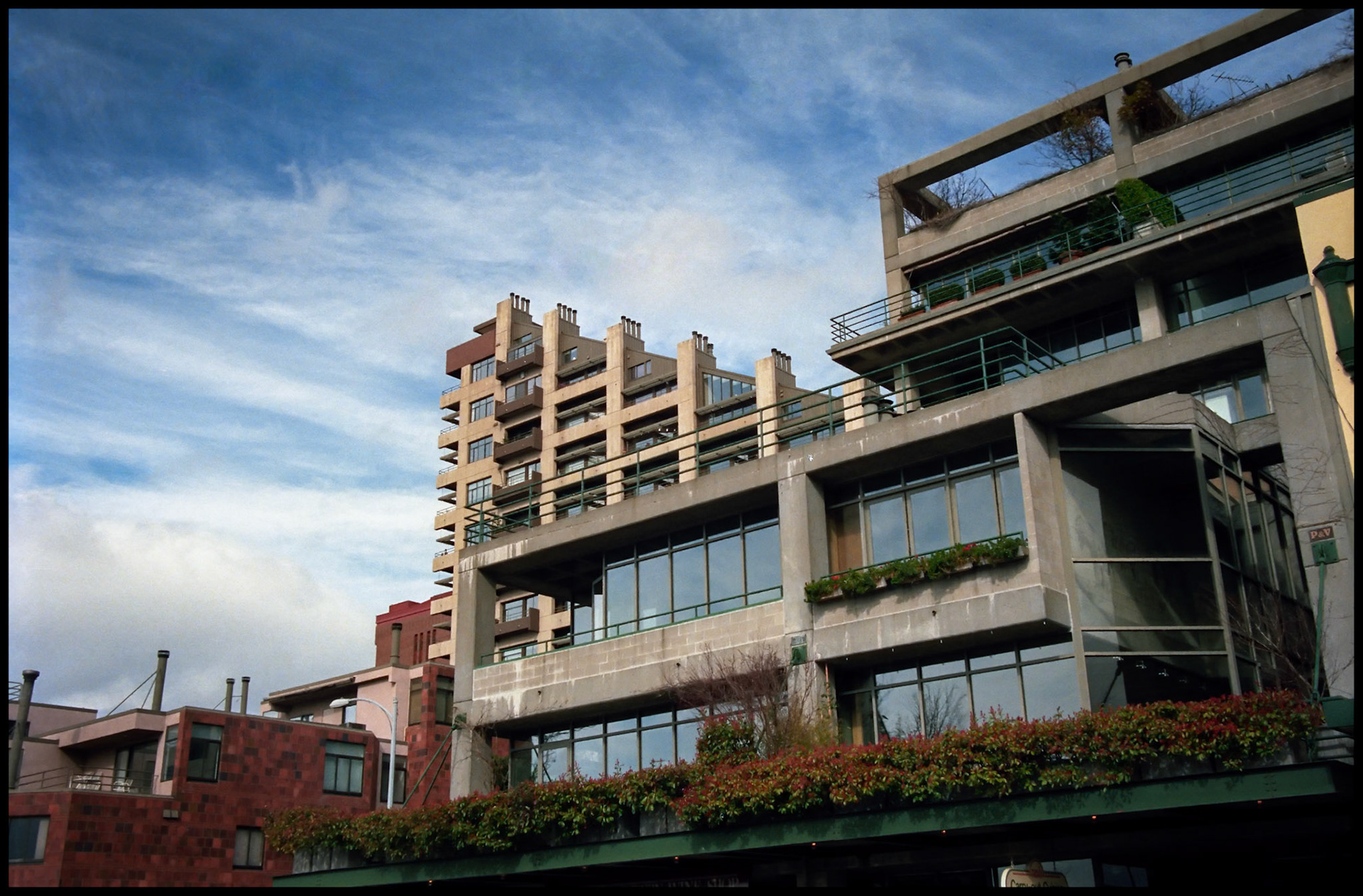 A vintage street scene of interesting triangular shaped buildings at the Seattle Washington waterfront at the corner of Pike Place and Virginia Street, 1987