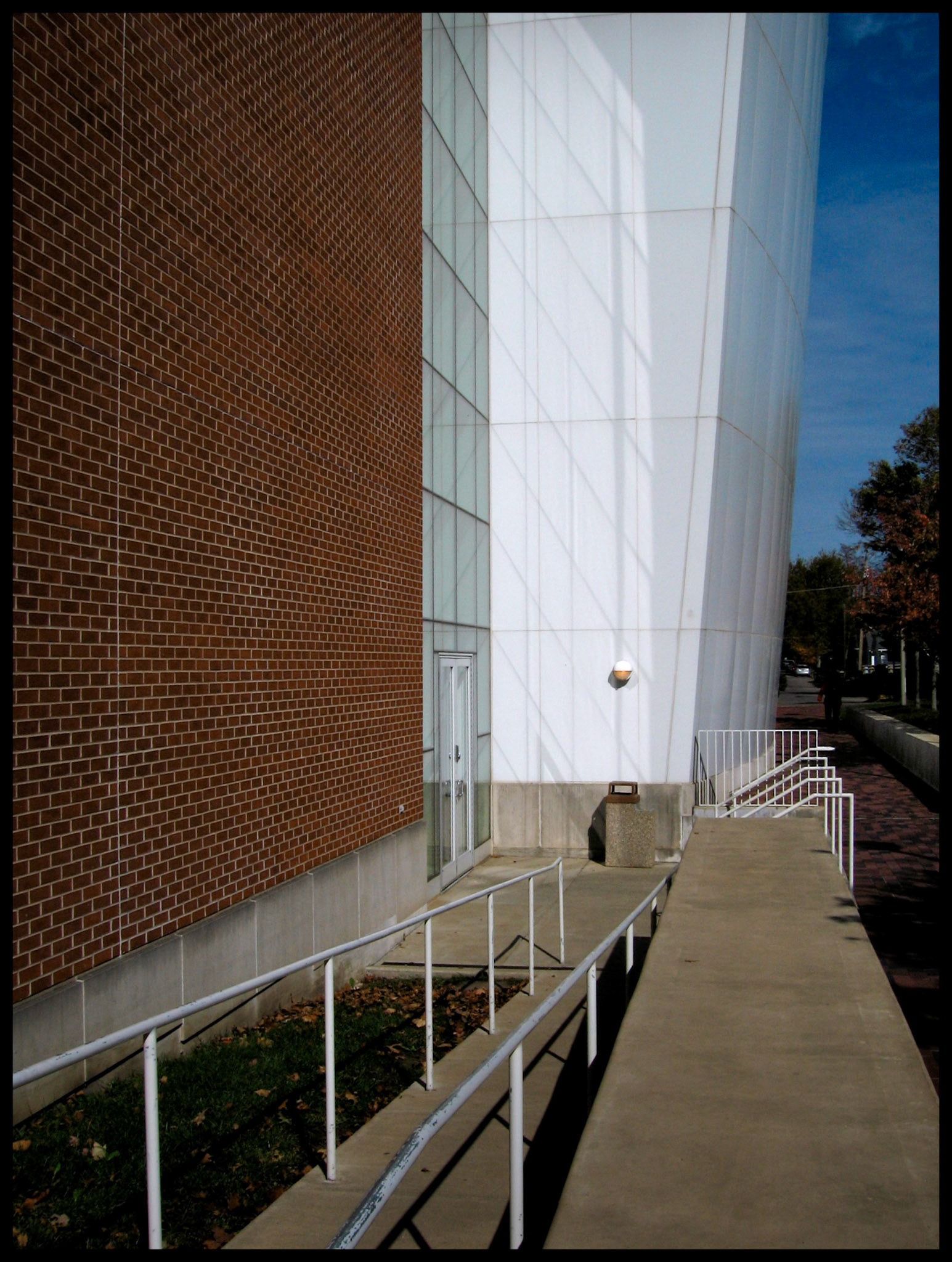 A minimal abstract view of reflected light and shadows at an entrance to the Ophelia Parrish building   on the Truman State University campus in Kirksville, Missouri. 2006